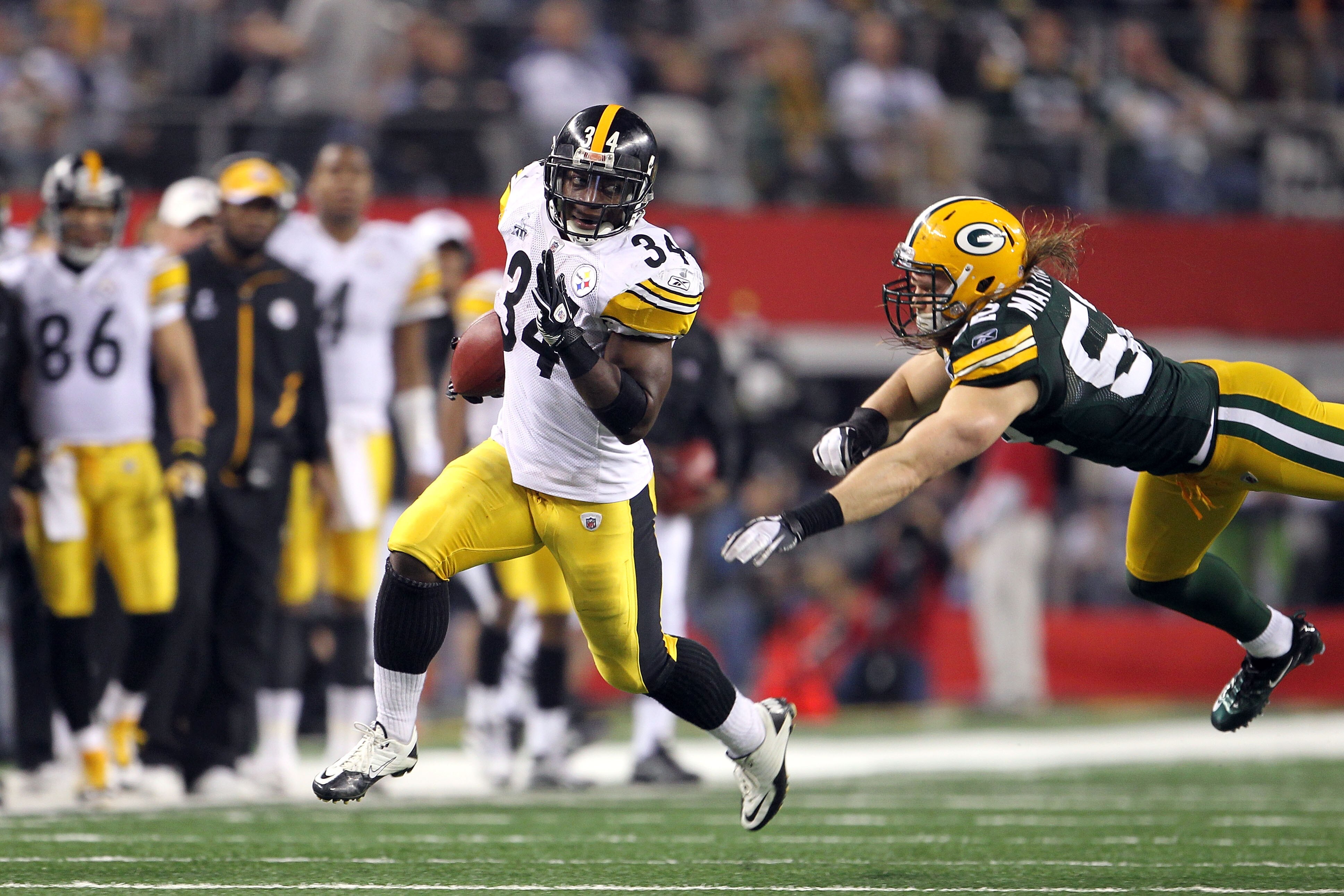 ARLINGTON, TX - FEBRUARY 06:  Rashard Mendenhall #34 of the Pittsburgh Steelers runs the ball against Clay Matthews #52 of the Green Bay Packers during Super Bowl XLV at Cowboys Stadium on February 6, 2011 in Arlington, Texas. The Packers won 31-25. (Phot
