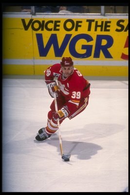 8 Dec 1991:  Center Doug Gilmour of the Calgary Flames moves the puck during a game againsst the Buffalo Sabres at Memorial Auditorium in Buffalo, New York. Mandatory Credit: Rick Stewart  /Allsport