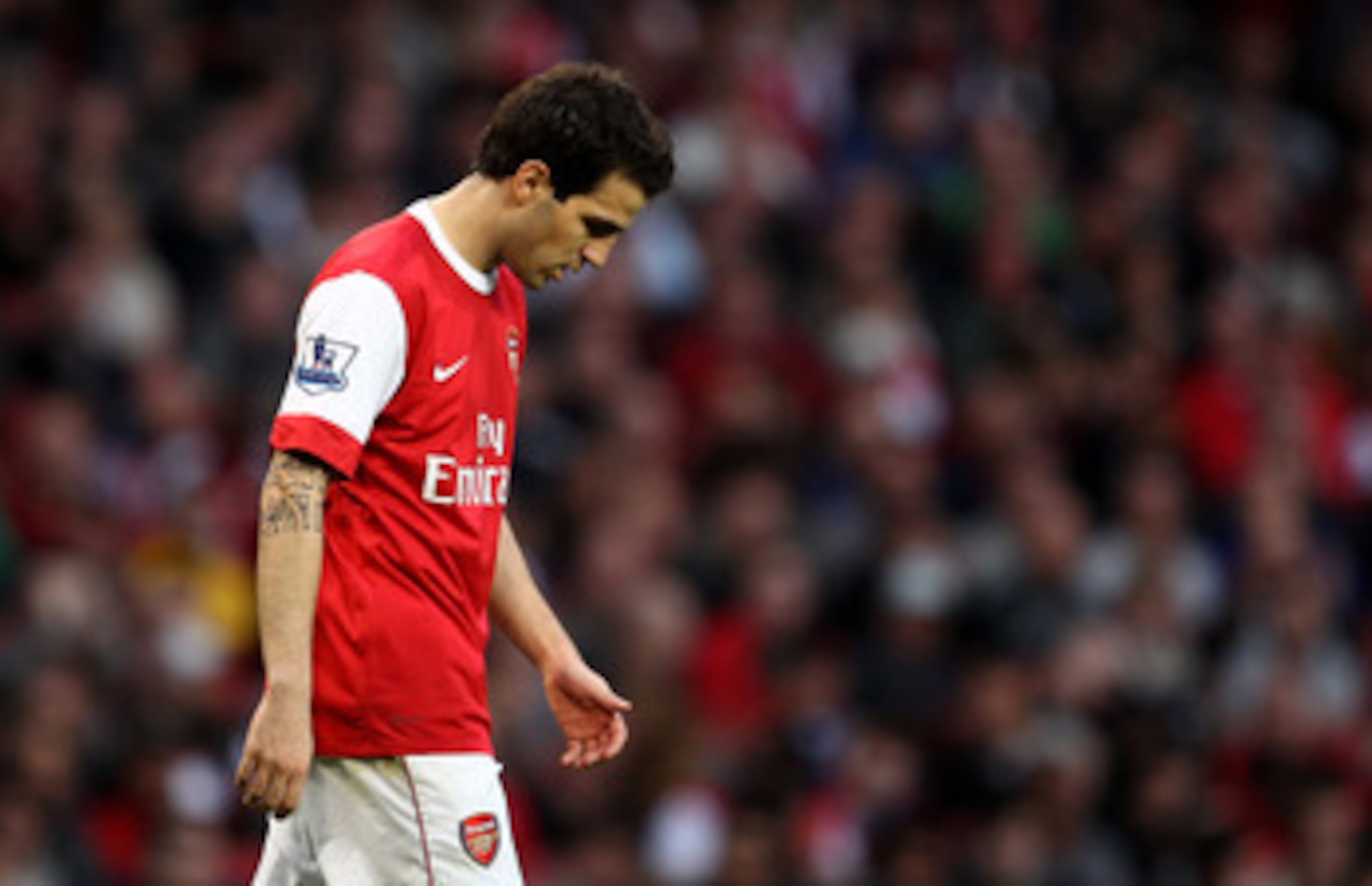 LONDON, ENGLAND - APRIL 02:  Cesc Fabregas of Arsenal walks dejectedduring the Barclays Premier League match between Arsenal and Blackburn Rovers at the Emirates Stadium on April 2, 2011 in London, England.  (Photo by Julian Finney/Getty Images)