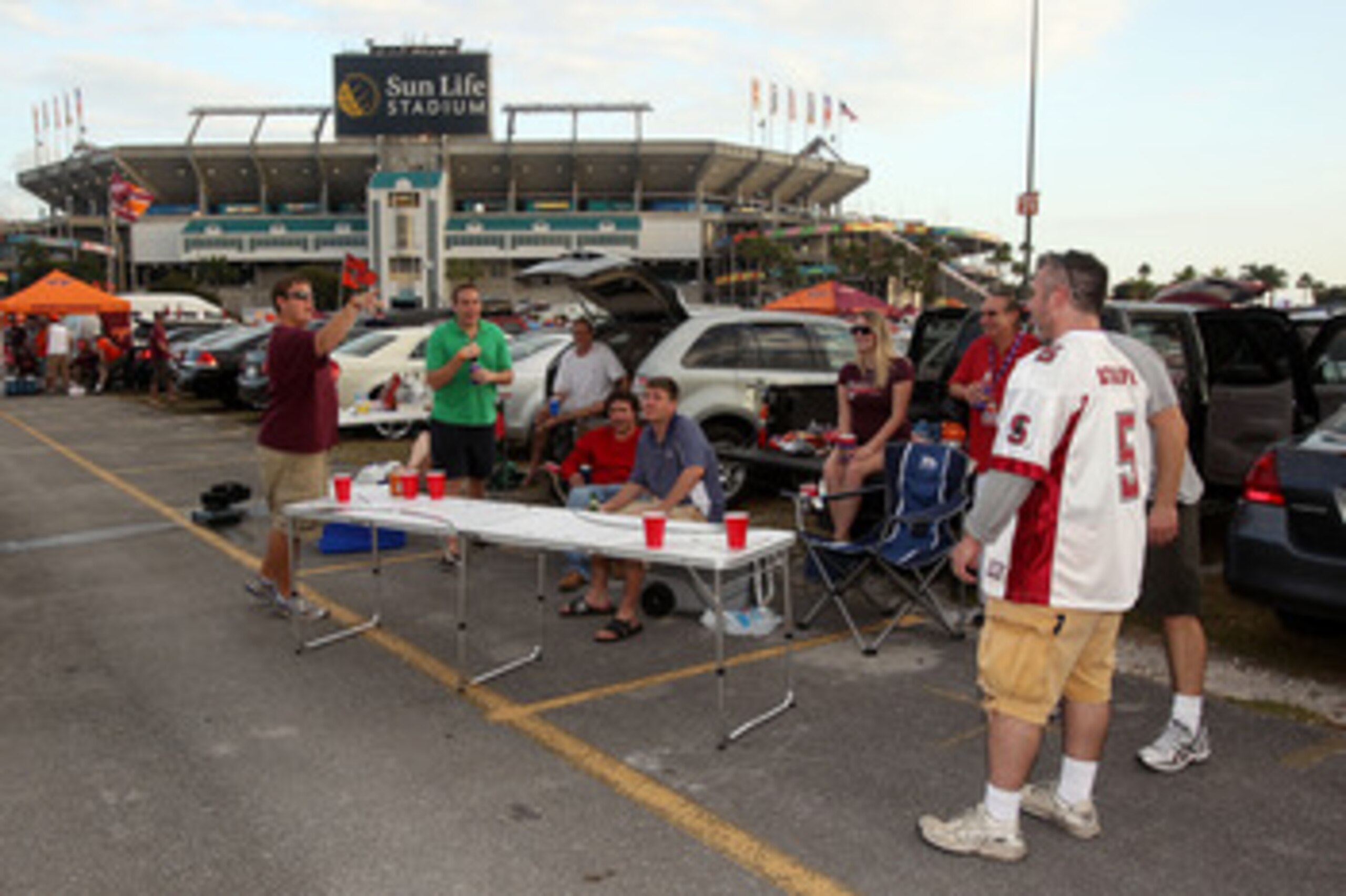 MIAMI, FL - JANUARY 03: Fans play beer pong in the parking lot as they tailgate prior to the Stanford Cardinal playing against the Virginai Tech Hokies during the 2011 Discover Orange Bowl at Sun Life Stadium on January 3, 2011 in Miami, Florida. (Photo MIAMI, FL - JANUARY 03: Fans play beer pong in the parking lot as they tailgate prior to the Stanford Cardinal playing against the Virginai Tech Hokies during the 2011 Discover Orange Bowl at Sun Life Stadium on January 3, 2011 in Miami, Florida. (Photo