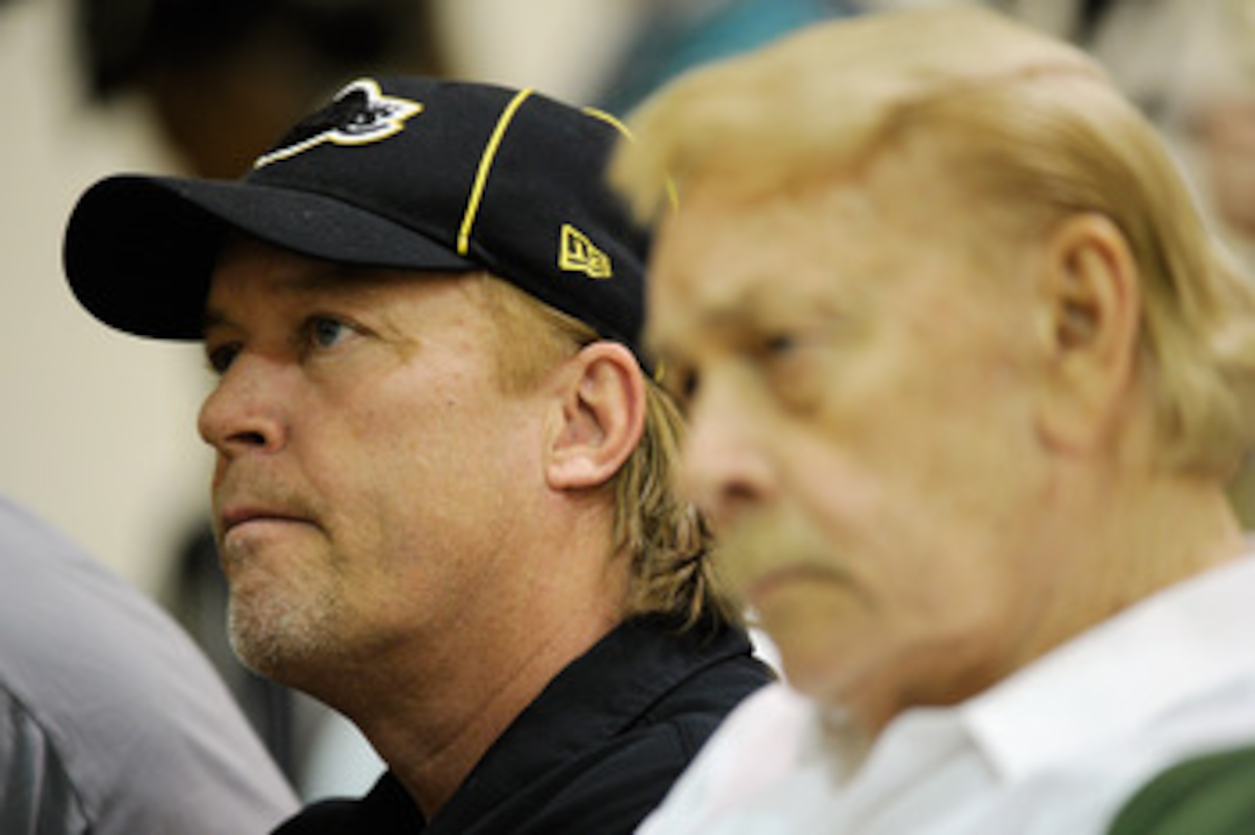 EL SEGUNDO, CA - MAY 31:  Jim Buss, executive vice president of basketball operations of the Los Angeles Lakers, listens to Lakers new coach Mike Brown's speach during his introductory news conference at the team's training facility on May 31, 2011 in El