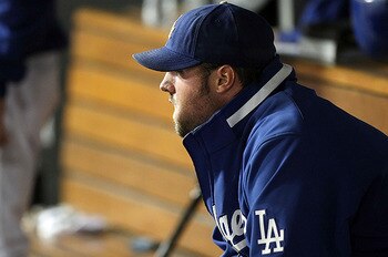 LOS ANGELES, CA - OCTOBER 13:  Jonathan Broxton #51 of the Los Angeles Dodgers sits in the dugout in the ninth inning against the Philadelphia Phillies in Game Four of the National League Championship Series during the 2008 MLB playoffs on October 13, 200