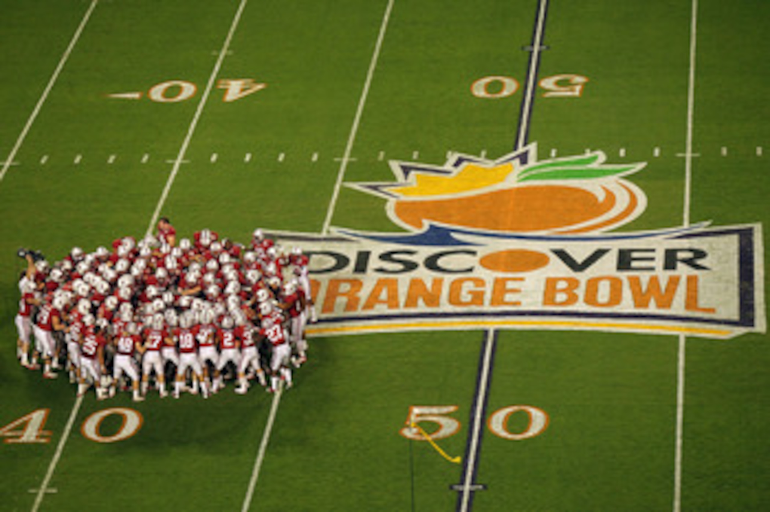 MIAMI, FL - JANUARY 03: The Stanford Cardinal huddle on the field prior to playing against the Virginia Tech Hokies during the 2011 Discover Orange Bowl at Sun Life Stadium on January 3, 2011 in Miami, Florida. Stanford won 40-12. (Photo by Mike Ehrmann MIAMI, FL - JANUARY 03: The Stanford Cardinal huddle on the field prior to playing against the Virginia Tech Hokies during the 2011 Discover Orange Bowl at Sun Life Stadium on January 3, 2011 in Miami, Florida. Stanford won 40-12. (Photo by Mike Ehrmann