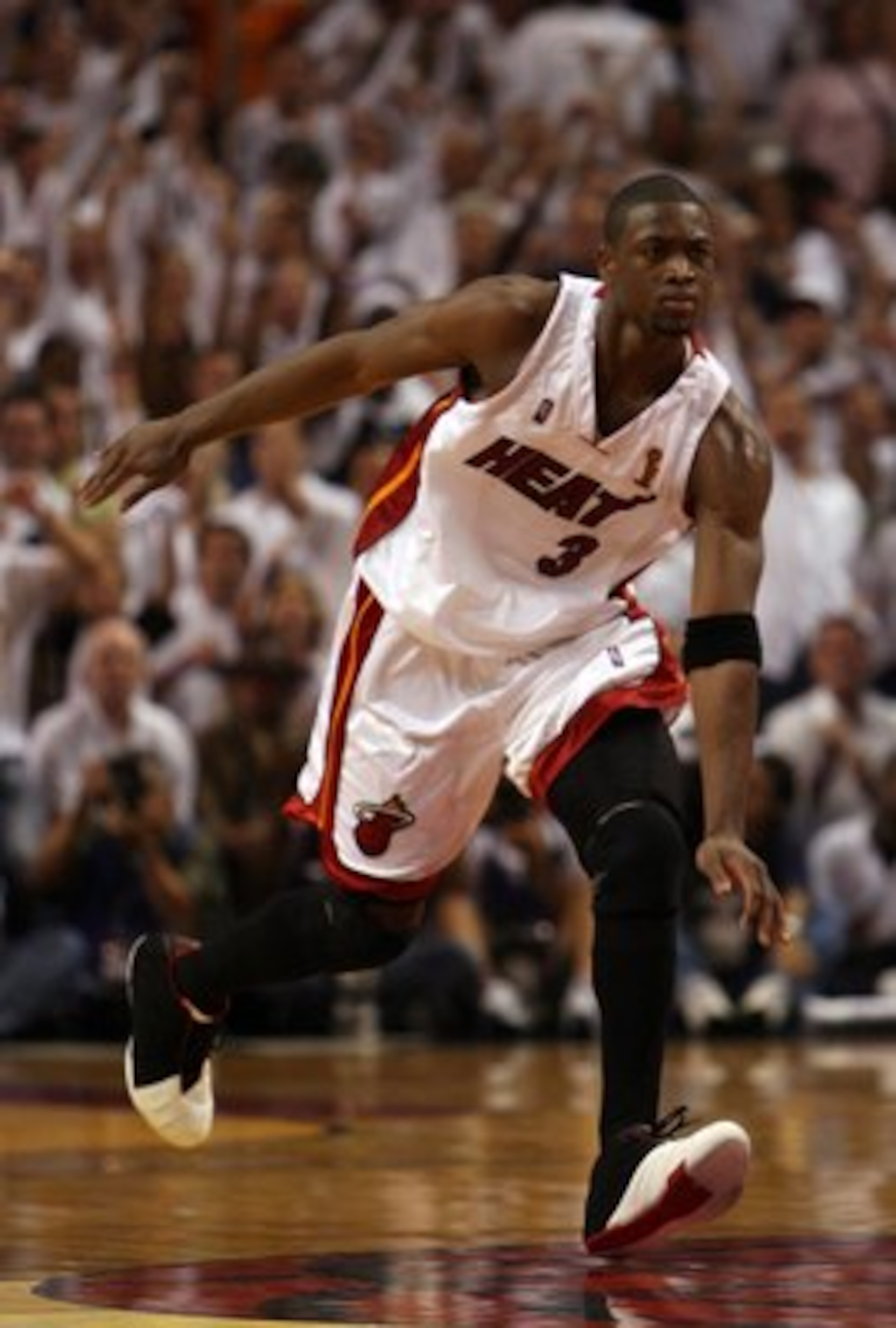 MIAMI - JUNE 18: Dwyane Wade #3 of the Miami Heat celebrates in the fourth quarter of game five of the 2006 NBA Finals against the Dallas Mavericks on June 18, 2006 at American Airlines Arena in Miami, Florida. NOTE TO USER: User expressly acknowledges MIAMI - JUNE 18: Dwyane Wade #3 of the Miami Heat celebrates in the fourth quarter of game five of the 2006 NBA Finals against the Dallas Mavericks on June 18, 2006 at American Airlines Arena in Miami, Florida. NOTE TO USER: User expressly acknowledges