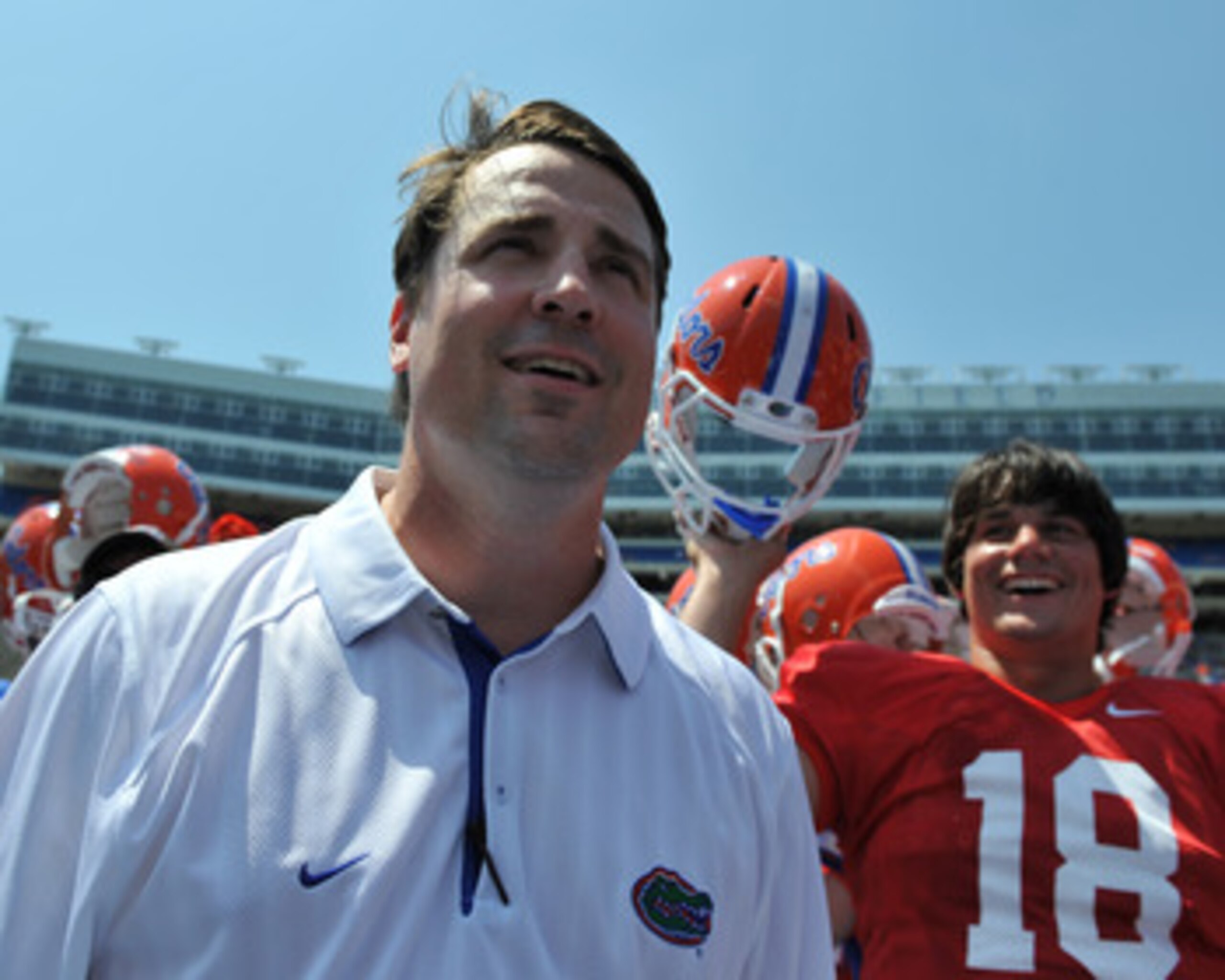 GAINESVILLE, FL - APRIL 9:  Coach Will Muschamp of the Florida Gators watches fans after the Orange and Blue spring football game April 9, 2011 at Ben Hill Griffin Stadium in Gainesville, Florida.  (Photo by Al Messerschmidt/Getty Images)