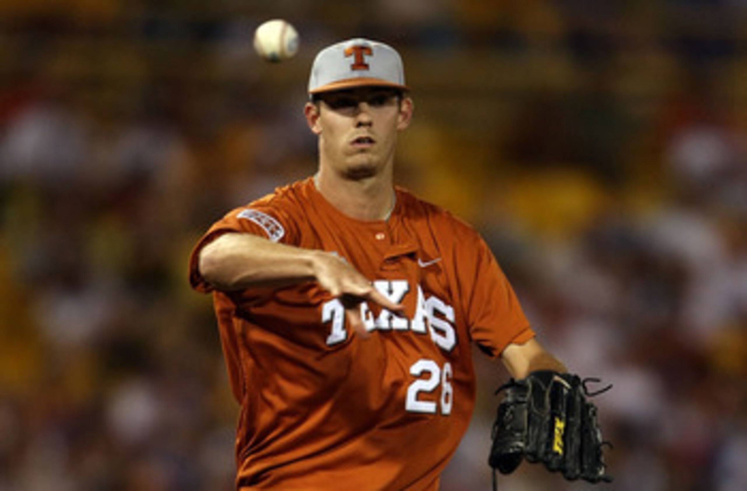 OMAHA, NE - JUNE 23:  Taylor Jungmann #26 of the Texas Longhorns sends the ball back to first against the Louisiana State University Tigers during Game 2 of the 2009 NCAA College World Series at Rosenblatt Stadium on June 23, 2009 in Omaha, Nebraska. The