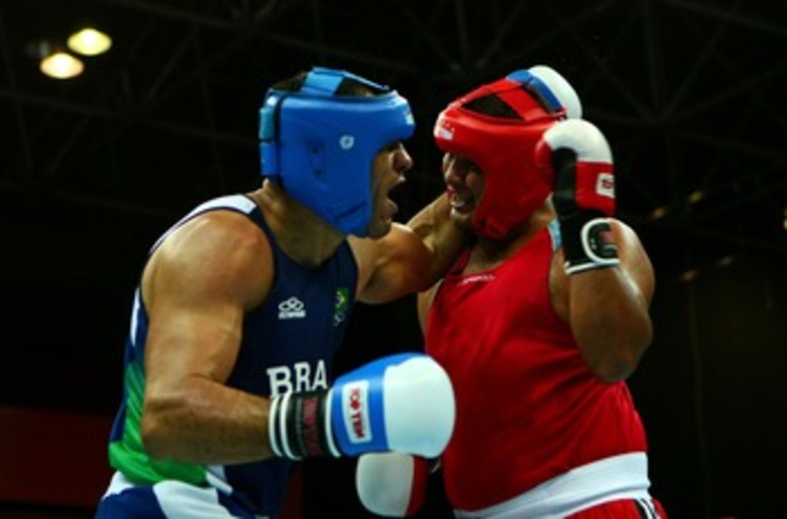 RIO DE JANEIRO, BRAZIL - JULY 23:  Antonio Rogerio Nogueira of Brazil and  Johnny Molina of Venezula exchange blows during Nogueira's win in the Super Heavy +91 kg Boxing Semifinals during the XV Pan American Games on July 23, 2007 at  in Rio De Janeiro,