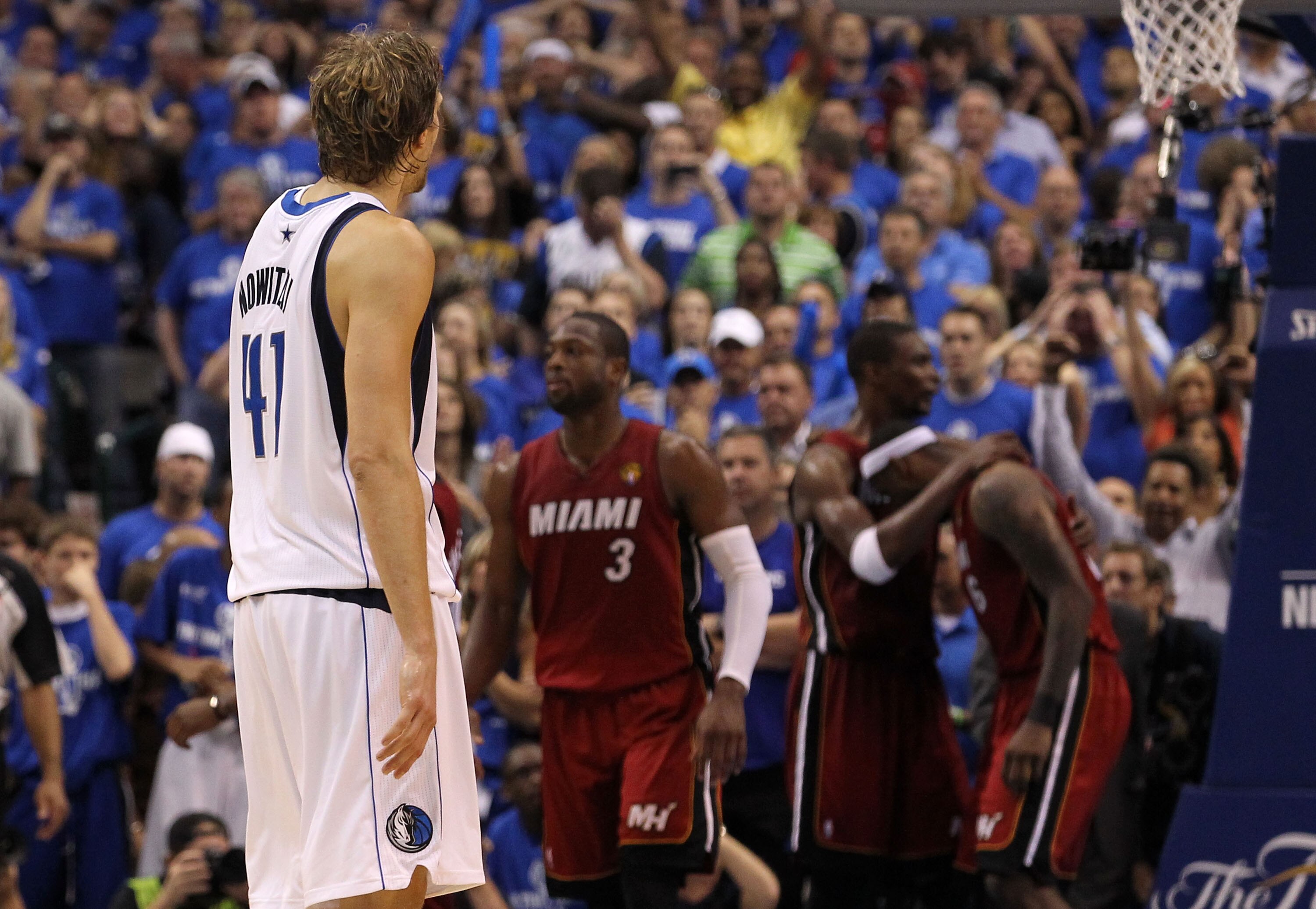 DALLAS, TX - JUNE 05:  Dirk Nowitzki #41 of the Dallas Mavericks looks on as Dwyane Wade #3, Chris Bosh #1 and LeBron James #6 of the Miami Heat react as the Heat defeat the Mavericks 88-86 in Game Three of the 2011 NBA Finals at American Airlines Center