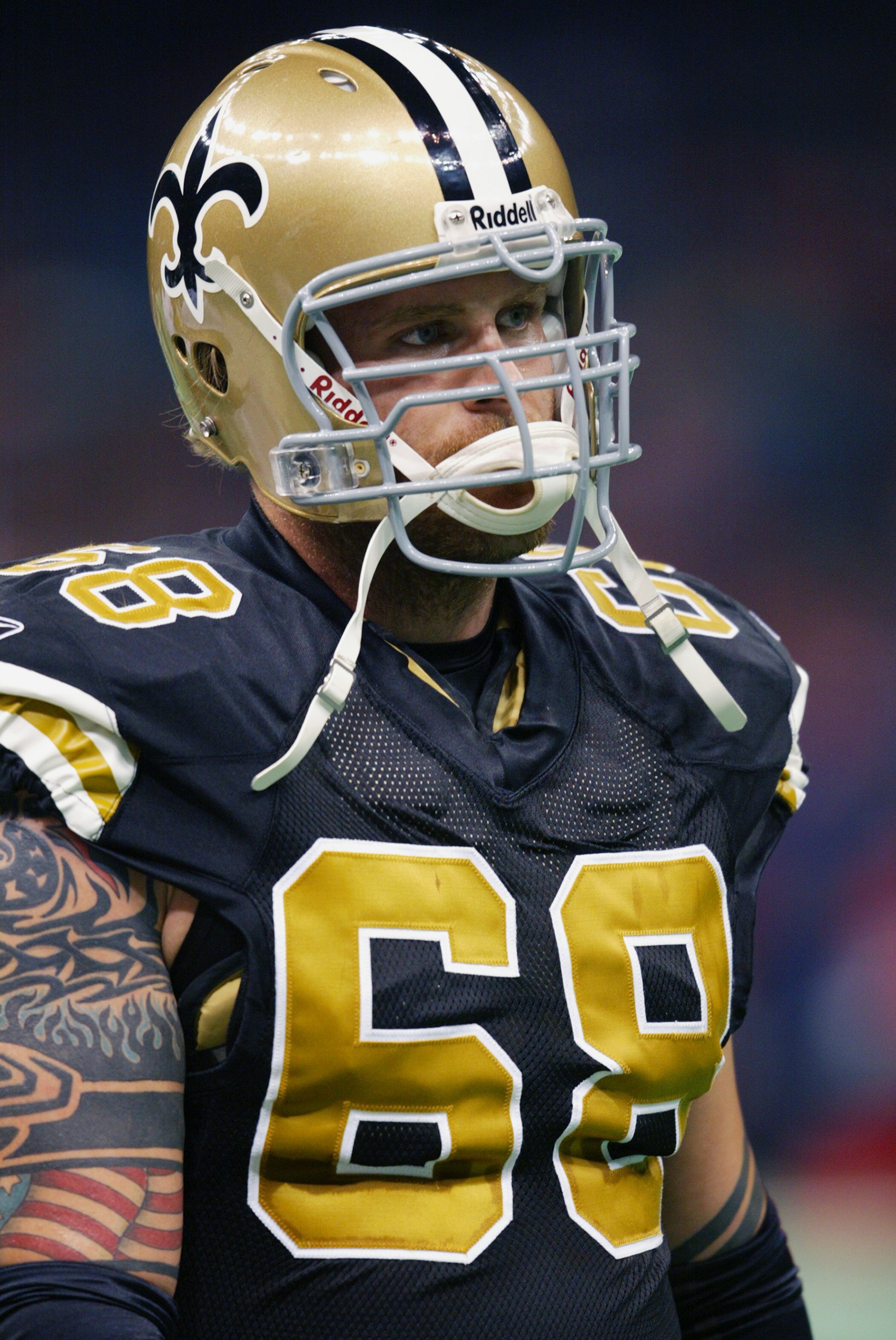 NEW ORLEANS - DECEMBER 1:  Kyle Turley #68 of the New Orleans Saints looks on against the Tampa Bay Buccanneers on December 1, 2002 at the Louisiana Superdome in New Orleans, Louisiana.  The Saints defeated the Buccanneers 23-20.  (Photo by Jamie Squire/G