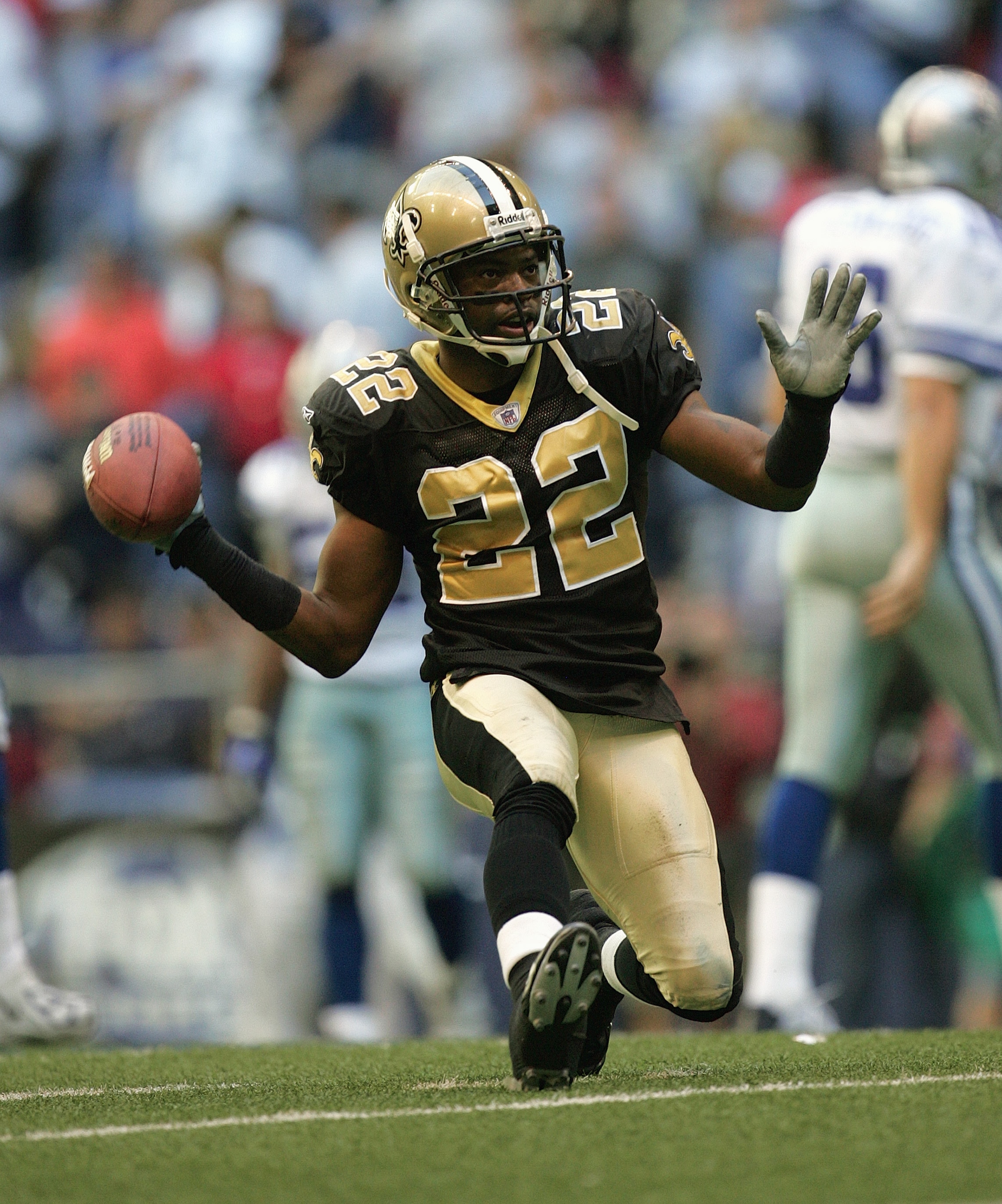 IRVING, TX - DECEMBER 12:  Cornerback Fred Thomas #22 of the New Orleans Saints celebrates during the game against the Dallas Cowboys on December 12, 2004 at Texas Stadium in Irving, Texas.  The Saints defeated the Cowboys 27-13.  (Photo by Ronald Martine