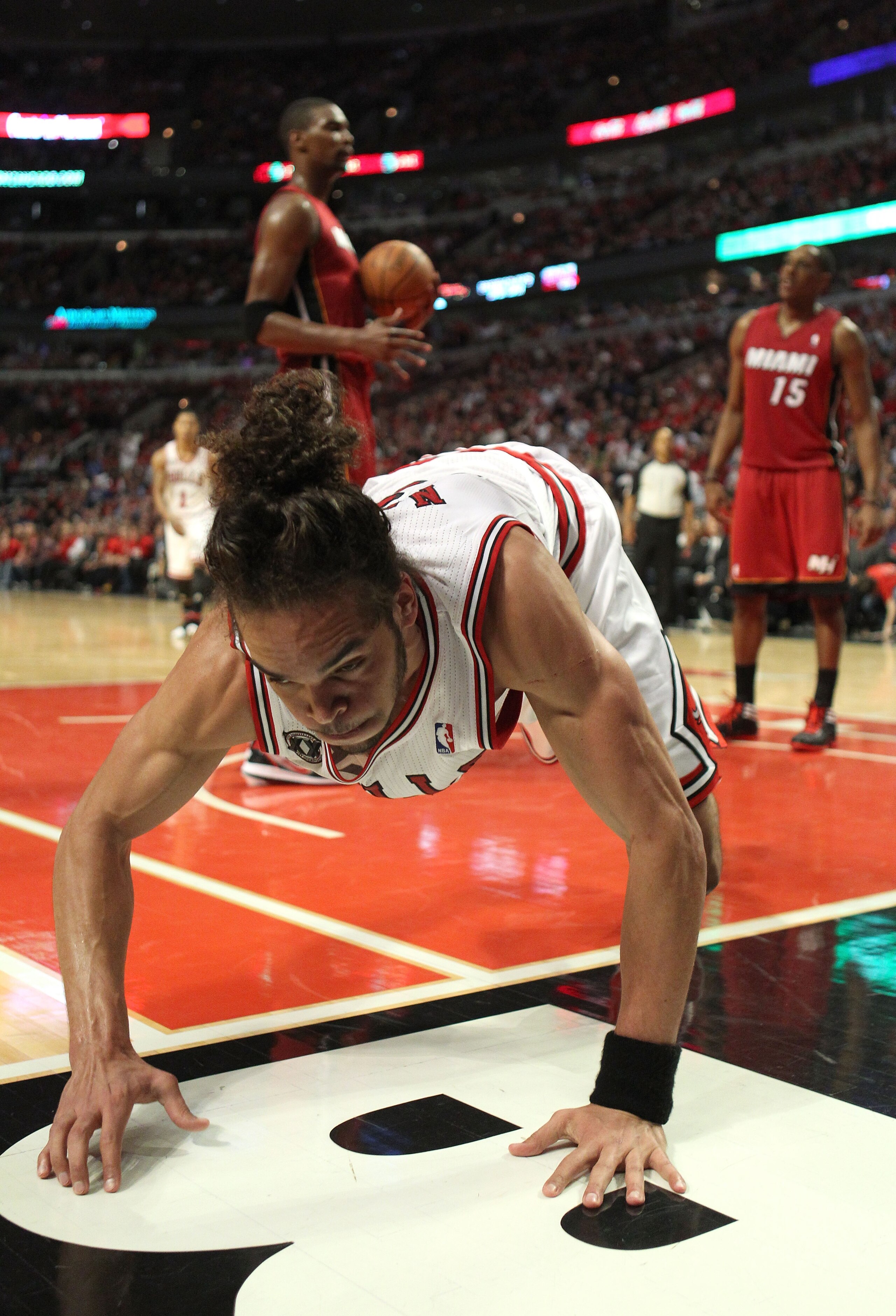 CHICAGO, IL - MAY 26: Joakim Noah #13 of the Chicago Bulls falls out of bounds against the Miami Heat in Game Five of the Eastern Conference Finals during the 2011 NBA Playoffs on May 26, 2011 at the United Center in Chicago, Illinois. NOTE TO USER: User CHICAGO, IL - MAY 26: Joakim Noah #13 of the Chicago Bulls falls out of bounds against the Miami Heat in Game Five of the Eastern Conference Finals during the 2011 NBA Playoffs on May 26, 2011 at the United Center in Chicago, Illinois. NOTE TO USER: User
