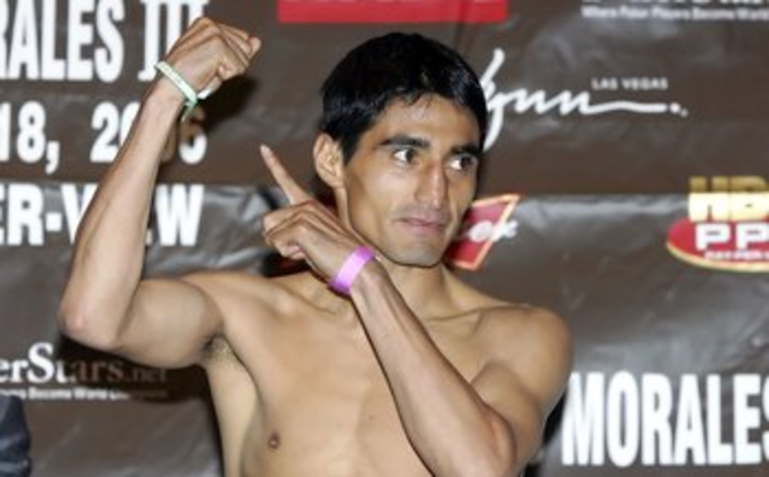 LAS VEGAS - NOVEMBER 17:  Erik Morales of Mexico points to his hand and during the official weigh-in for his bout against Manny Pacquiao of the Philippines at the Thomas & Mack Center on November 17, 2006 in Las Vegas, Nevada. The boxers will meet for the