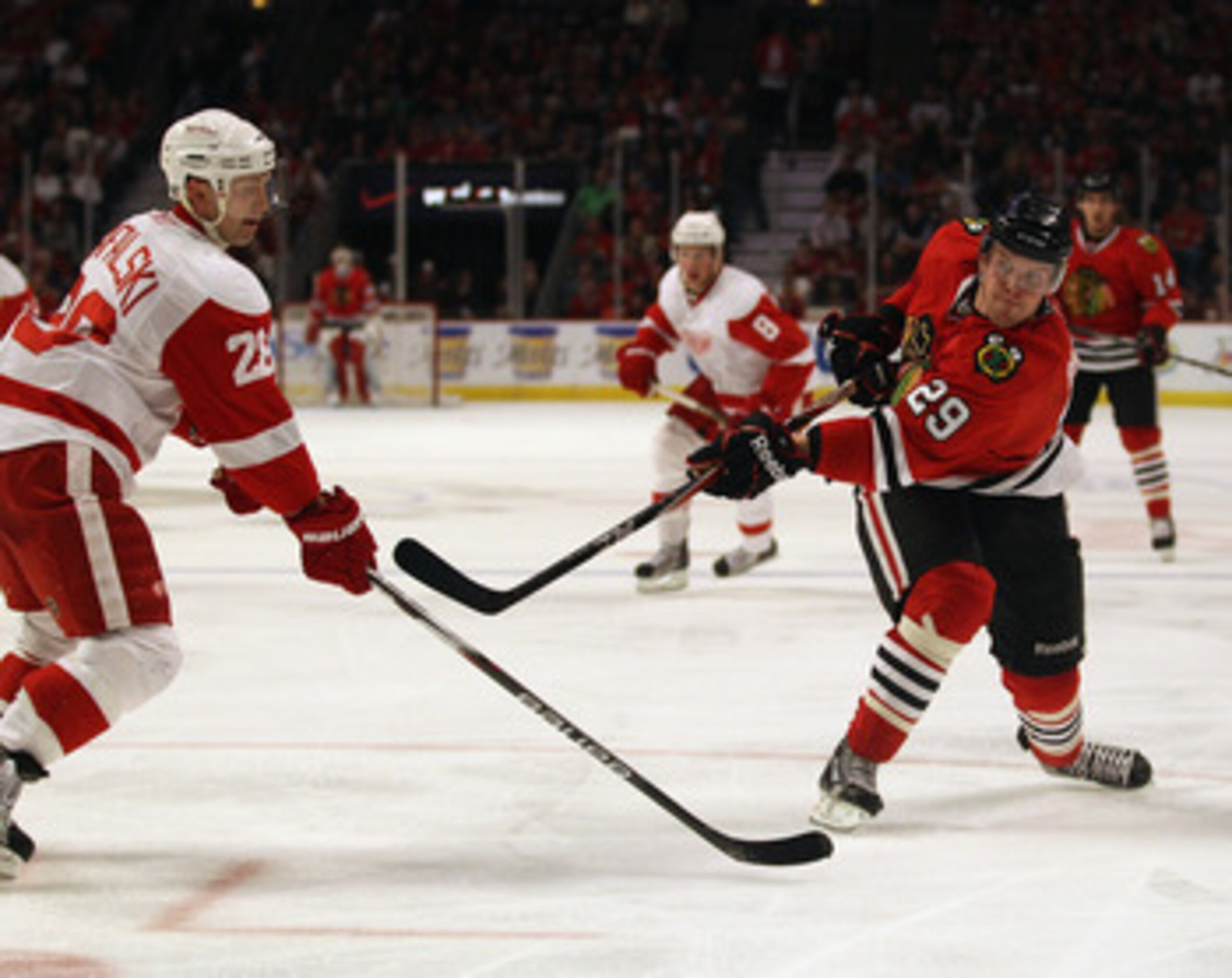 CHICAGO, IL - APRIL 10: Bryan Bickell #29 of the Chicago Blackhawks shoots the puck past Brian Rafalski #28 of the Detroit Red Wings at the United Center on April 10, 2011 in Chicago, Illinois. The Red Wings defeated the Blackhawks 4-3. (Photo by Jonathan