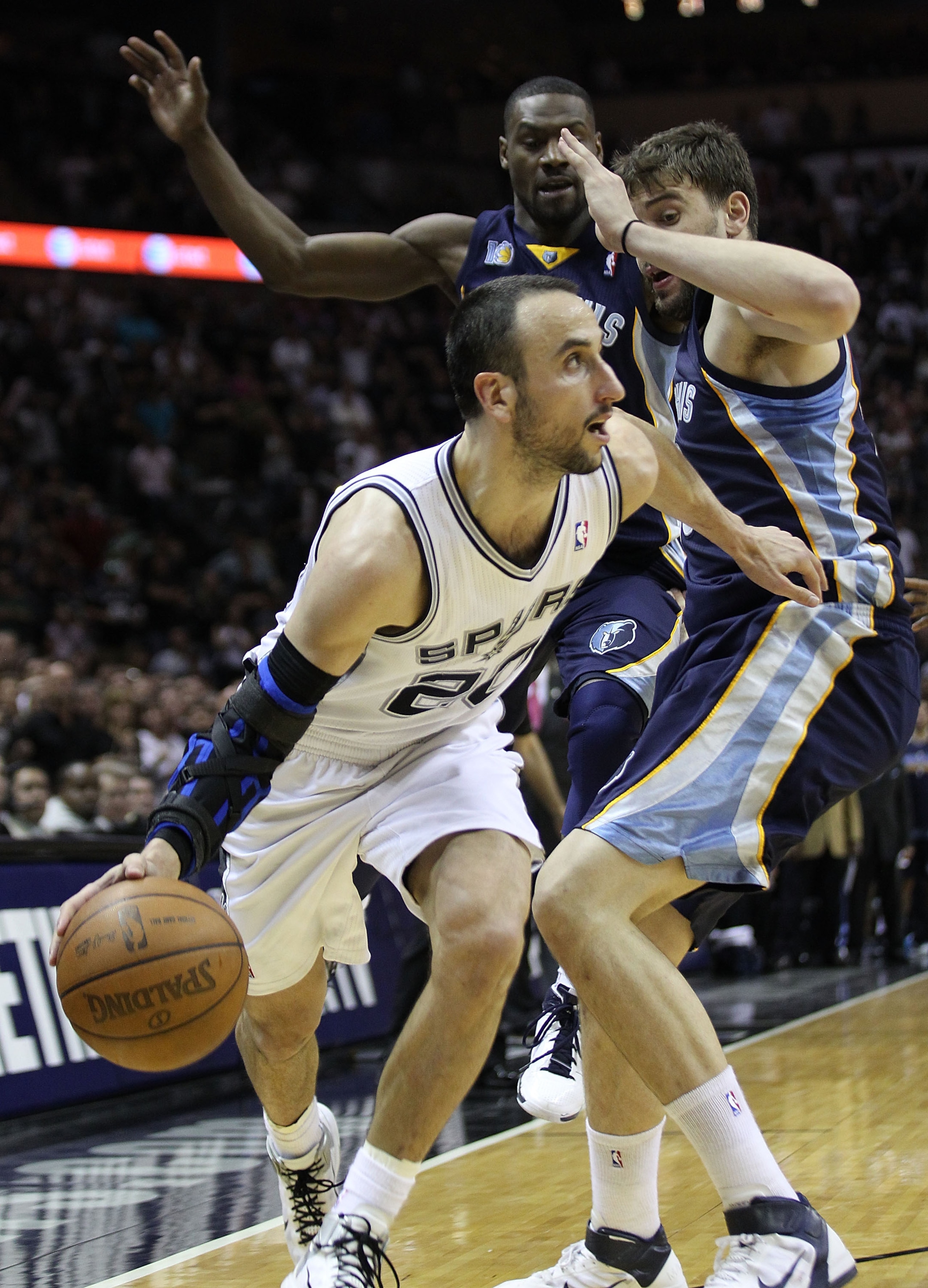 SAN ANTONIO, TX - APRIL 27: Manu Ginobili #20 of the San Antionio Spurs drives against Marc Gasol #33 of the Memphis Grizzlies in Game Five of the Western Conference Quarterfinals in the 2011 NBA Playoffs on April 27, 2011 at AT&T Center in San Antonio, SAN ANTONIO, TX - APRIL 27: Manu Ginobili #20 of the San Antionio Spurs drives against Marc Gasol #33 of the Memphis Grizzlies in Game Five of the Western Conference Quarterfinals in the 2011 NBA Playoffs on April 27, 2011 at AT&T Center in San Antonio,