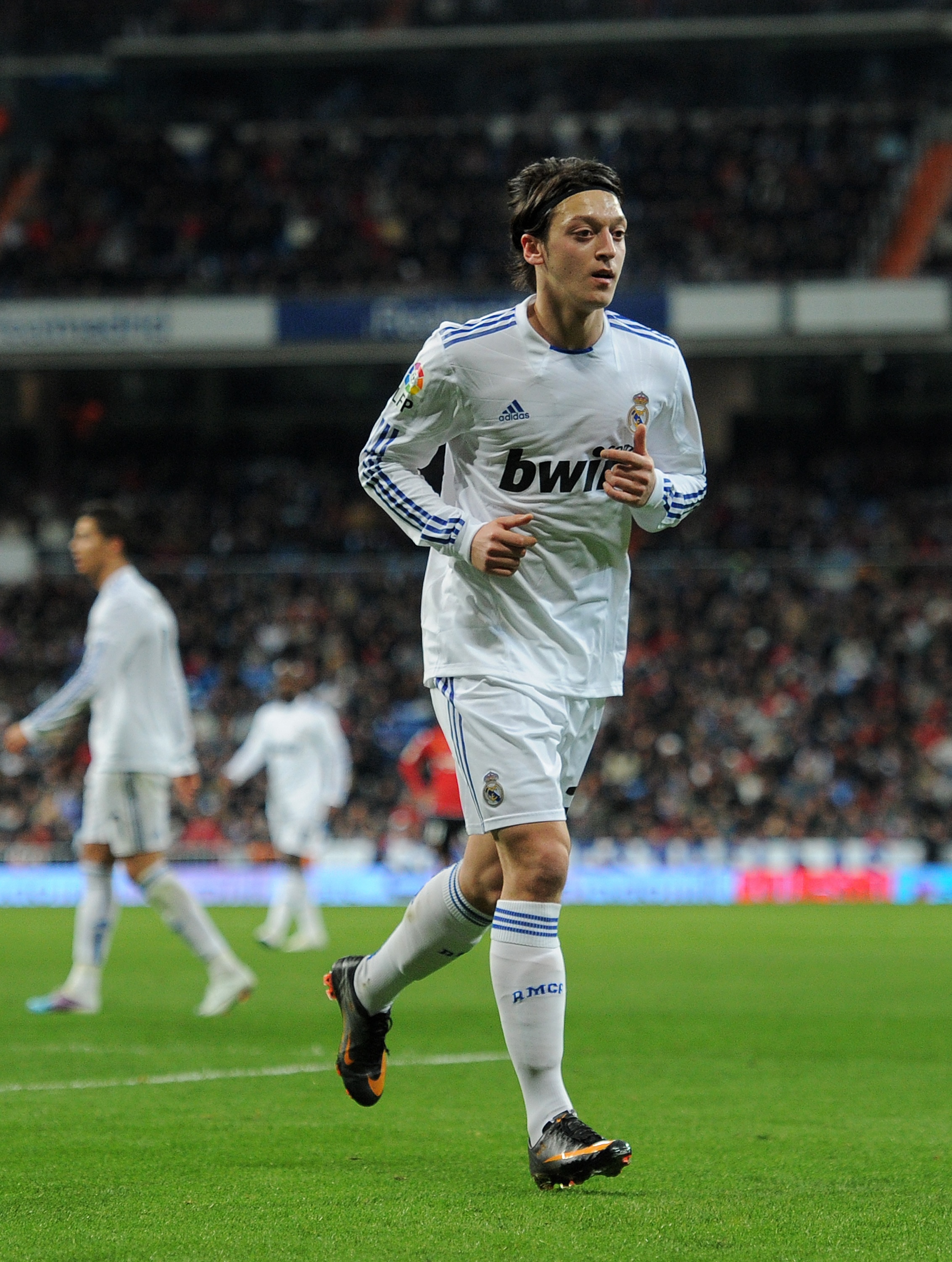 MADRID, SPAIN - JANUARY 23:  Mesut Ozil of Real Madrid runs on the pitch during the la liga match between Real Madrid and Mallorca at Estadio Santiago Bernabeu on January  23, 2011 in Madrid, Spain.  (Photo by Jasper Juinen/Getty Images)