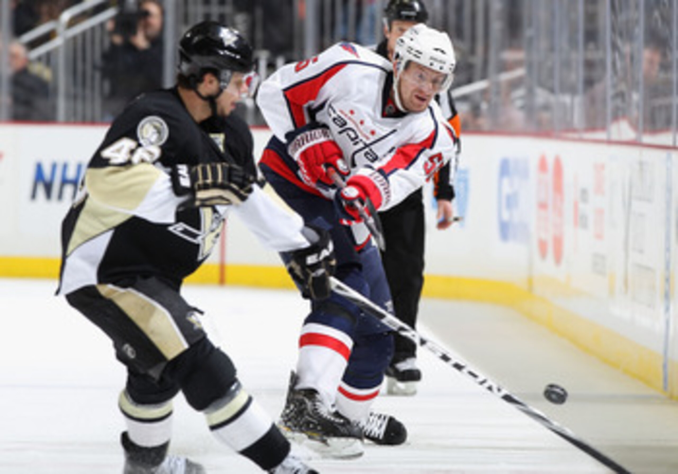 PITTSBURGH, PA - FEBRUARY 21:  Jeff Schultz  #55 of the Washington Capitals clears the puck during the NHL game against the Pittsburgh Penguins at Consol Energy Center on February 21, 2011 in Pittsburgh, Pennsylvania. The Capitals defeated the Penguins 1-