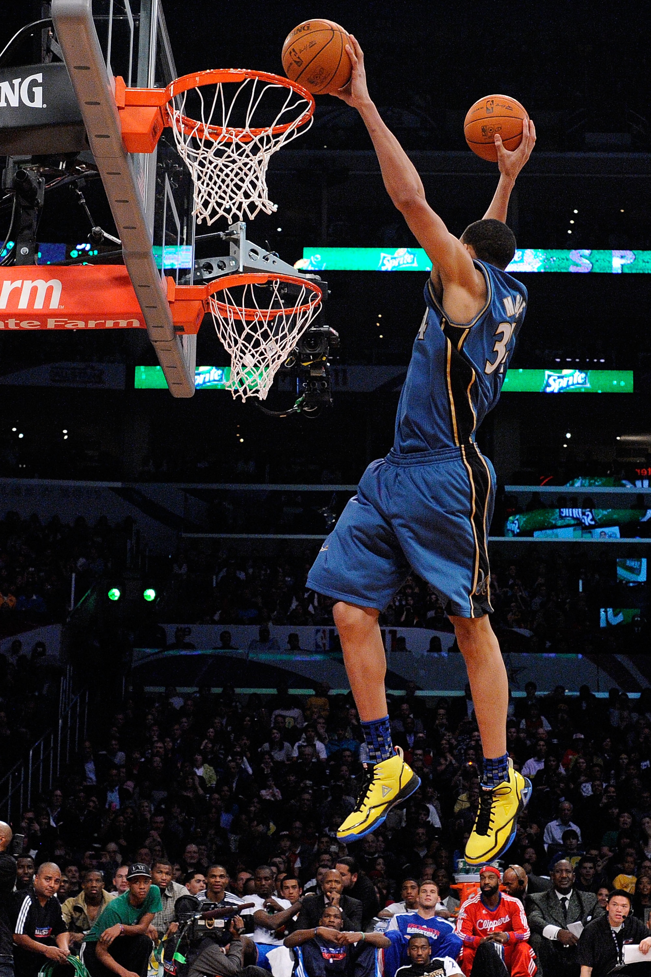 LOS ANGELES, CA - FEBRUARY 19:  JaVale McGee #34 of the Washington Wizards dunks two balls on the same jump in the first round of the Sprite Slam Dunk Contest apart of NBA All-Star Saturday Night at Staples Center on February 19, 2011 in Los Angeles, Cali