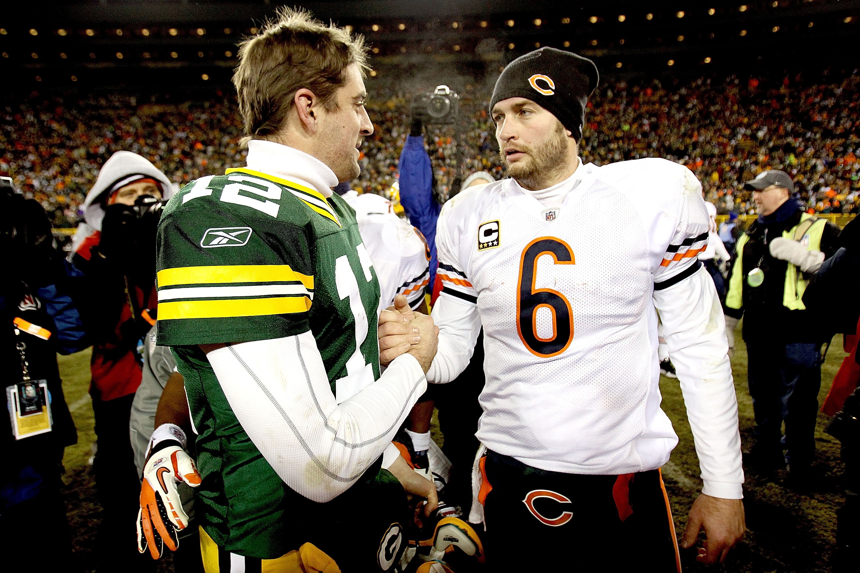 GREEN BAY, WI - JANUARY 02:  Quarterback Aaron Rodgers #12 of the Green Bay Packers is congratukated by quarterback Jay Cutler #6 of the Chicago Bears at Lambeau Field on January 2, 2011 in Green Bay, Wisconsin.  (Photo by Matthew Stockman/Getty Images)
