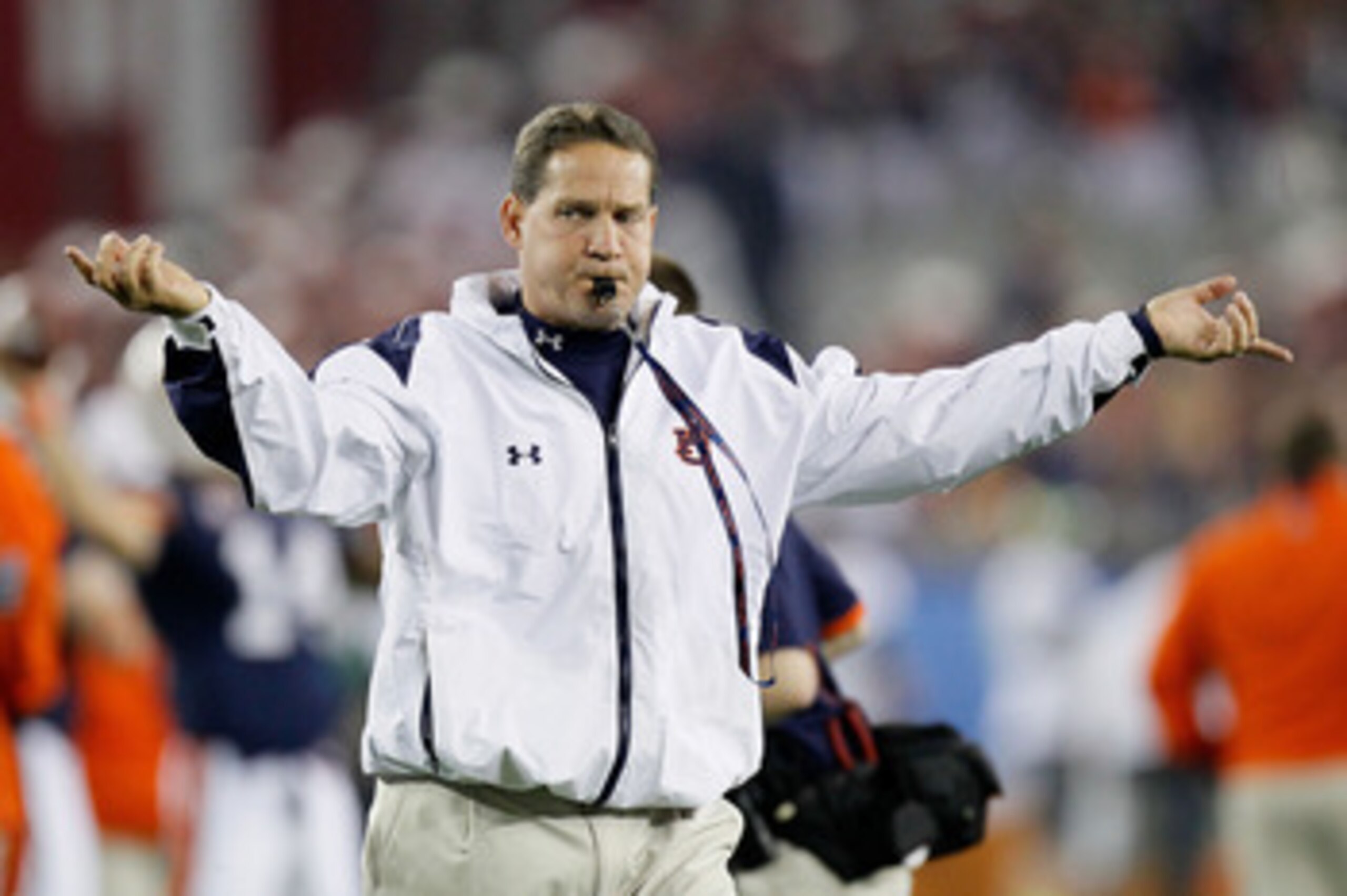 GLENDALE, AZ - JANUARY 10:  Head coach Gene Chizik of the Auburn Tigers reacts on the sideline against the Oregon Ducks during the Tostitos BCS National Championship Game at University of Phoenix Stadium on January 10, 2011 in Glendale, Arizona.  (Photo b