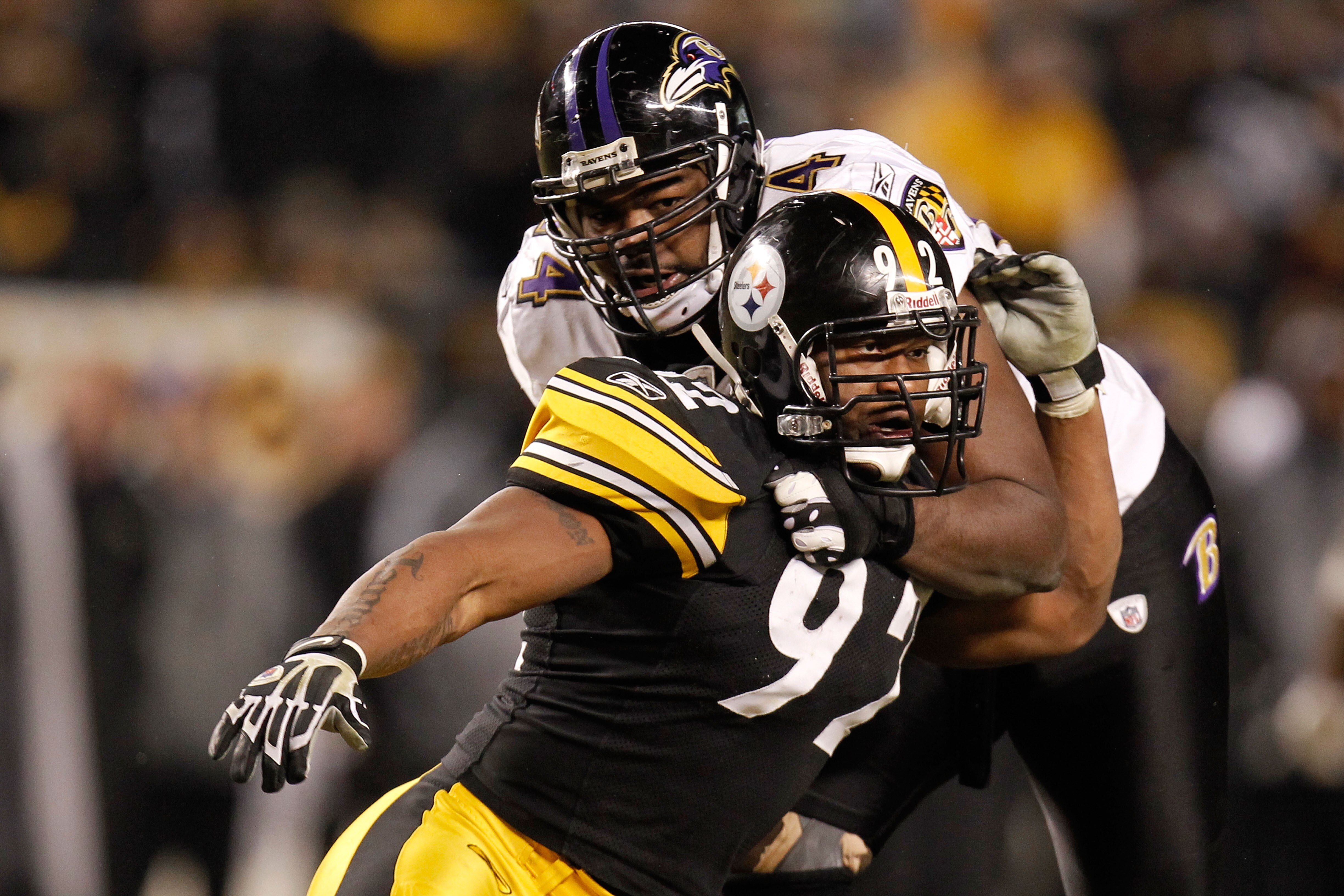 PITTSBURGH, PA - JANUARY 15:  Linebacker James Harrison #92 of the Pittsburgh Steelers rushes against offensive tackle Michael Oher #74 of the Baltimore Ravens during the AFC Divisional Playoff Game at Heinz Field on January 15, 2011 in Pittsburgh, Pennsy