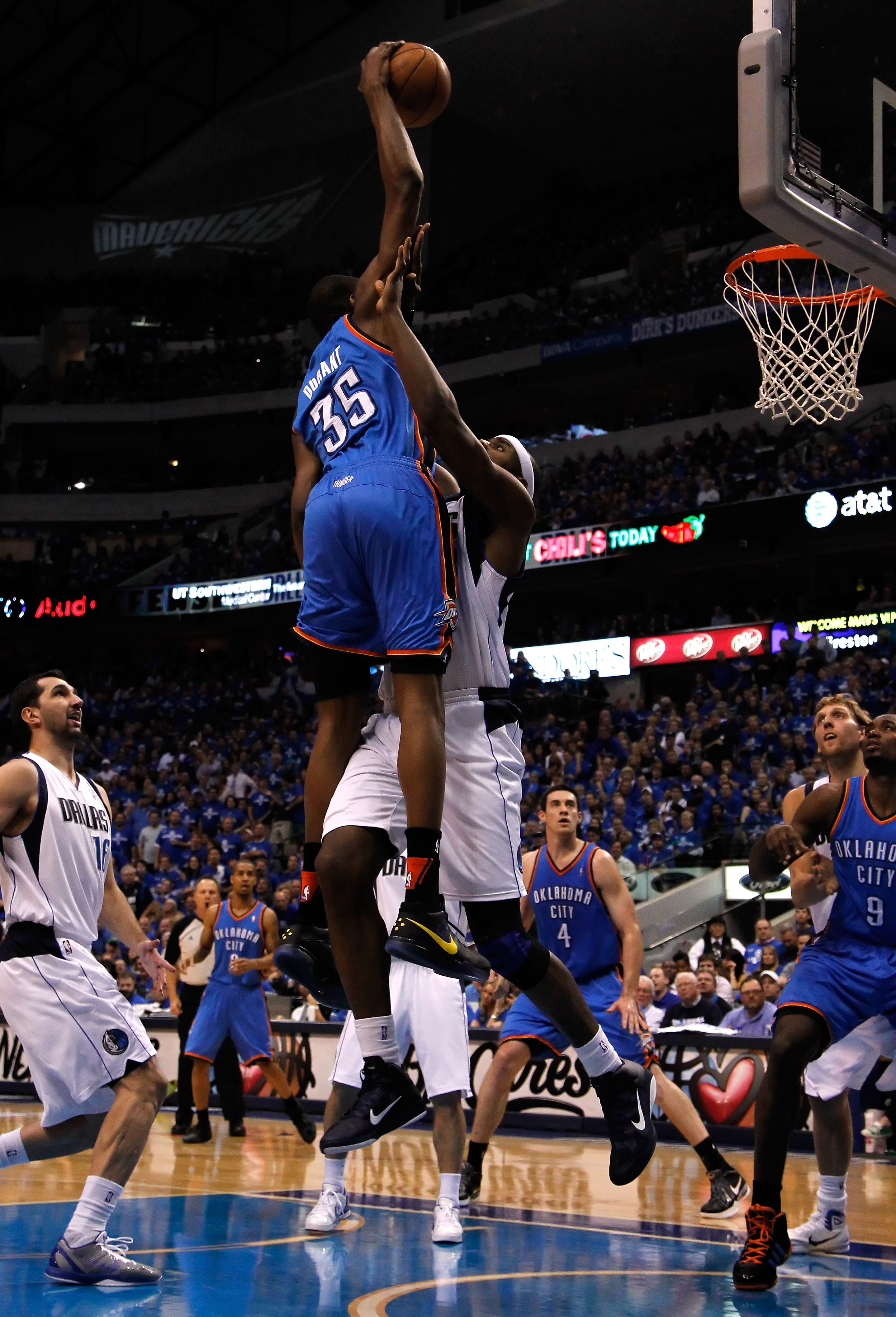 DALLAS, TX - MAY 19:  Kevin Durant #35 of the Oklahoma City Thunder dunks the ball over Brendan Haywood #33 of the Dallas Mavericks as Haywood is called for a foul in the first quarter in Game Two of the Western Conference Finals during the 2011 NBA Playo