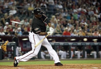 PHOENIX, AZ - JUNE 04:  Justin Upton #10 of the Arizona Diamondbacks hits a single against the Washington Nationals during the fourth inning of the Major League Baseball game at Chase Field on June 4, 2011 in Phoenix, Arizona.  (Photo by Christian Peterse