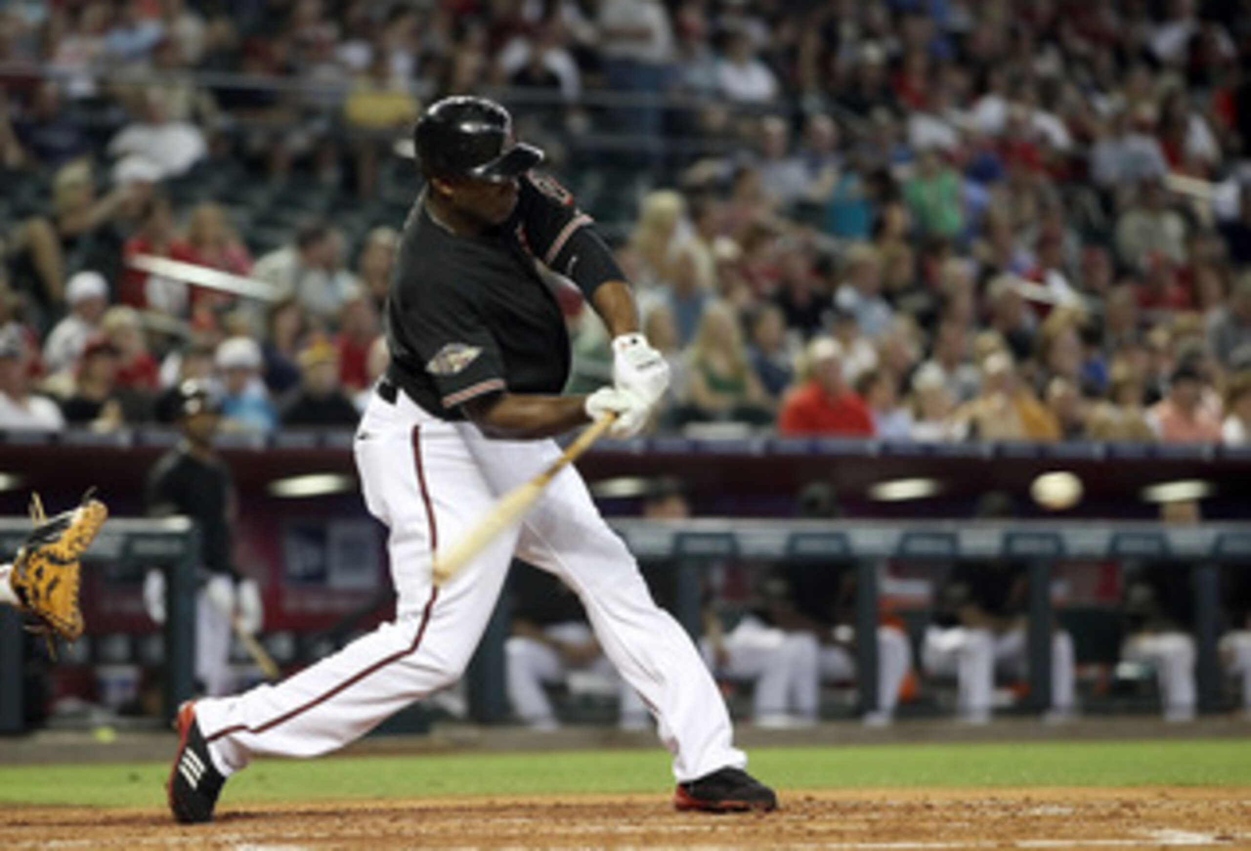 PHOENIX, AZ - JUNE 04:  Justin Upton #10 of the Arizona Diamondbacks hits a single against the Washington Nationals during the fourth inning of the Major League Baseball game at Chase Field on June 4, 2011 in Phoenix, Arizona.  (Photo by Christian Peterse