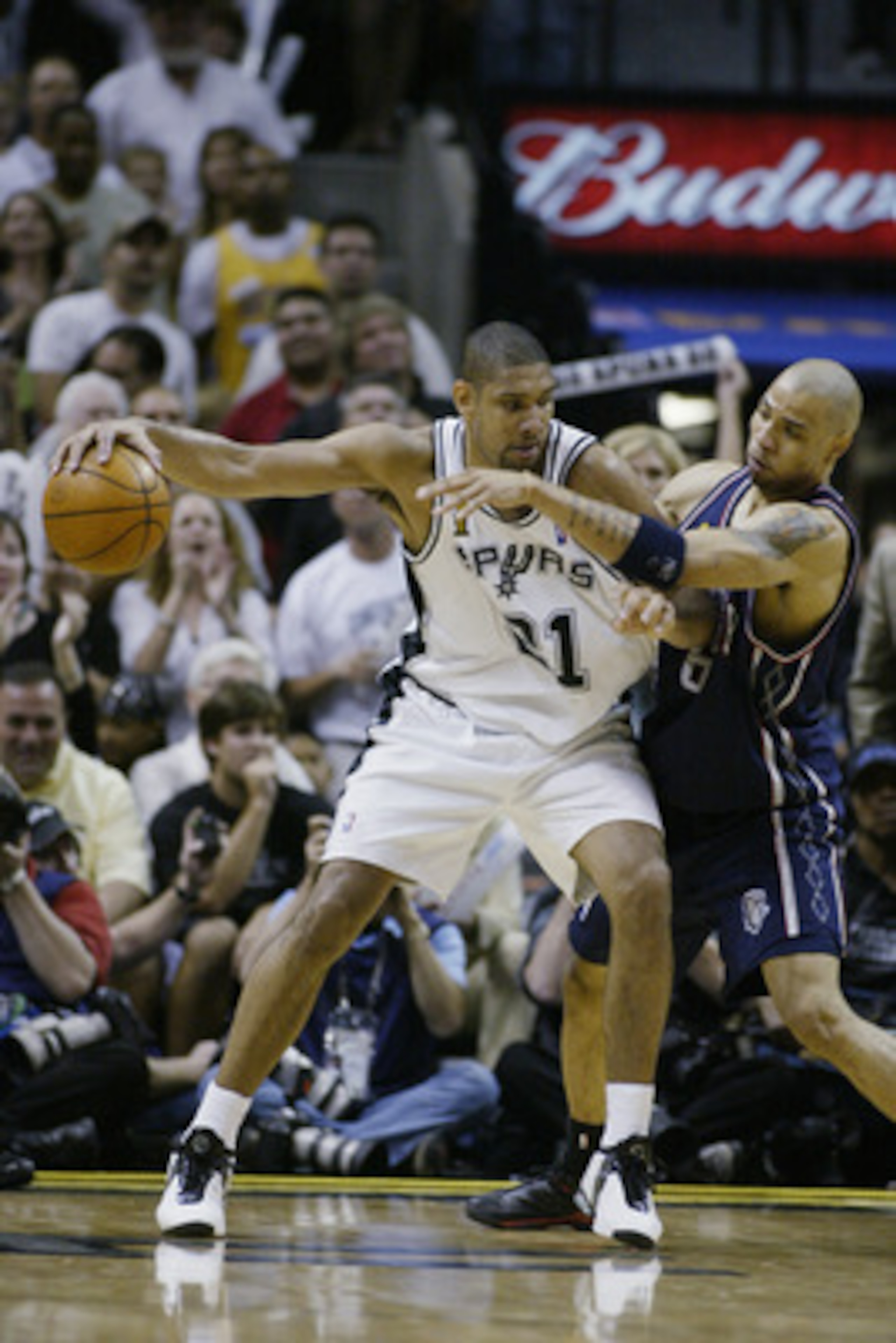 SAN ANTONIO, TX - JUNE 15: Tim Duncan #21 of the San Antonio Spurs is defended by Kenyon Martin #6 of the New Jersey Nets in Game six of the 2003 NBA Finals on June 15, 2003 at the SBC Center in San Antonio, Texas. The Spurs won 88-77 and defeated the N SAN ANTONIO, TX - JUNE 15: Tim Duncan #21 of the San Antonio Spurs is defended by Kenyon Martin #6 of the New Jersey Nets in Game six of the 2003 NBA Finals on June 15, 2003 at the SBC Center in San Antonio, Texas. The Spurs won 88-77 and defeated the N
