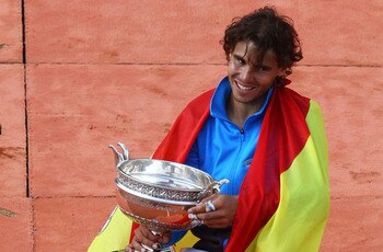 PARIS, FRANCE - JUNE 05:  Champion Rafael Nadal of Spain poses with the trophy following his victory during the men's singles final match between Rafael Nadal of Spain and Roger Federer of Switzerland on day fifteen of the French Open at Roland Garros on