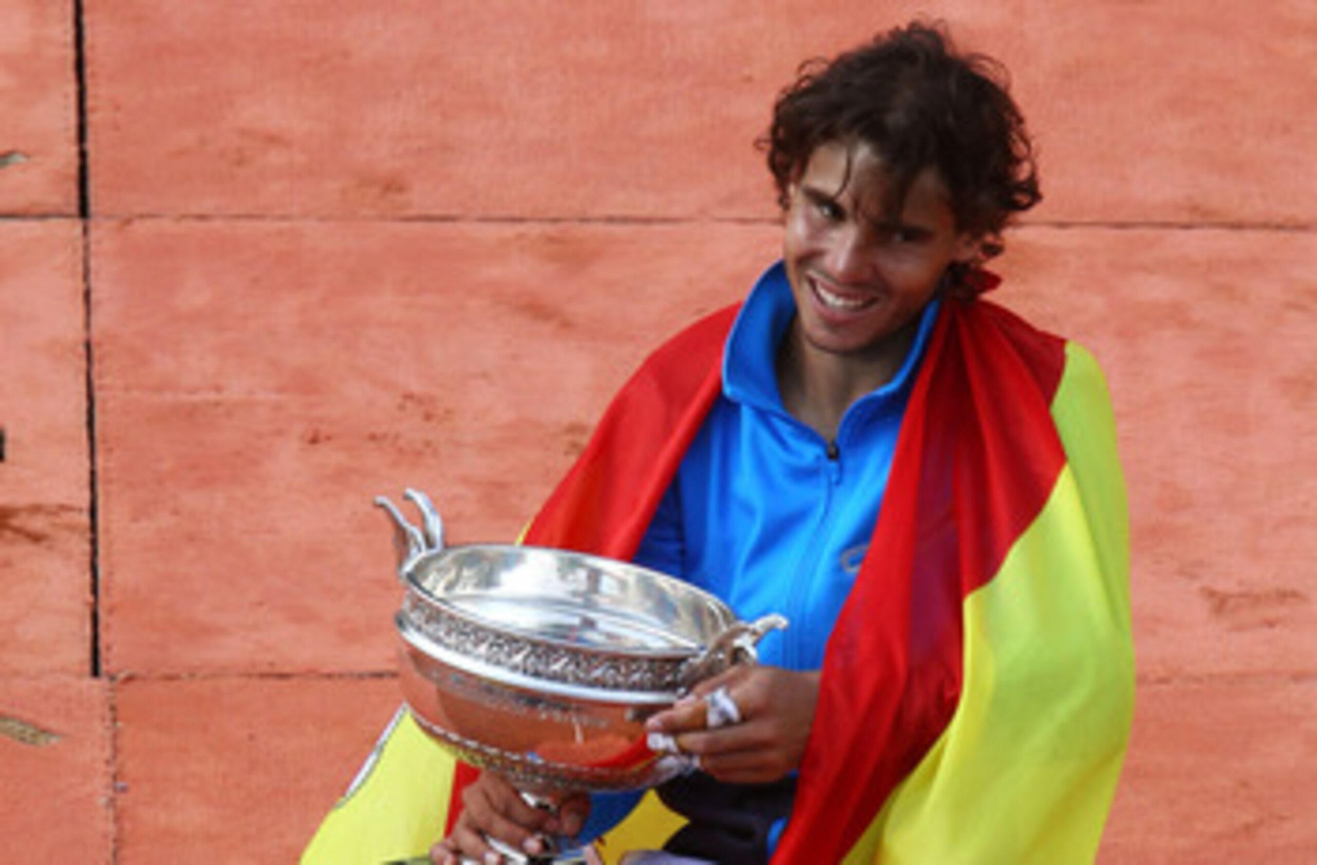 PARIS, FRANCE - JUNE 05:  Champion Rafael Nadal of Spain poses with the trophy following his victory during the men's singles final match between Rafael Nadal of Spain and Roger Federer of Switzerland on day fifteen of the French Open at Roland Garros on