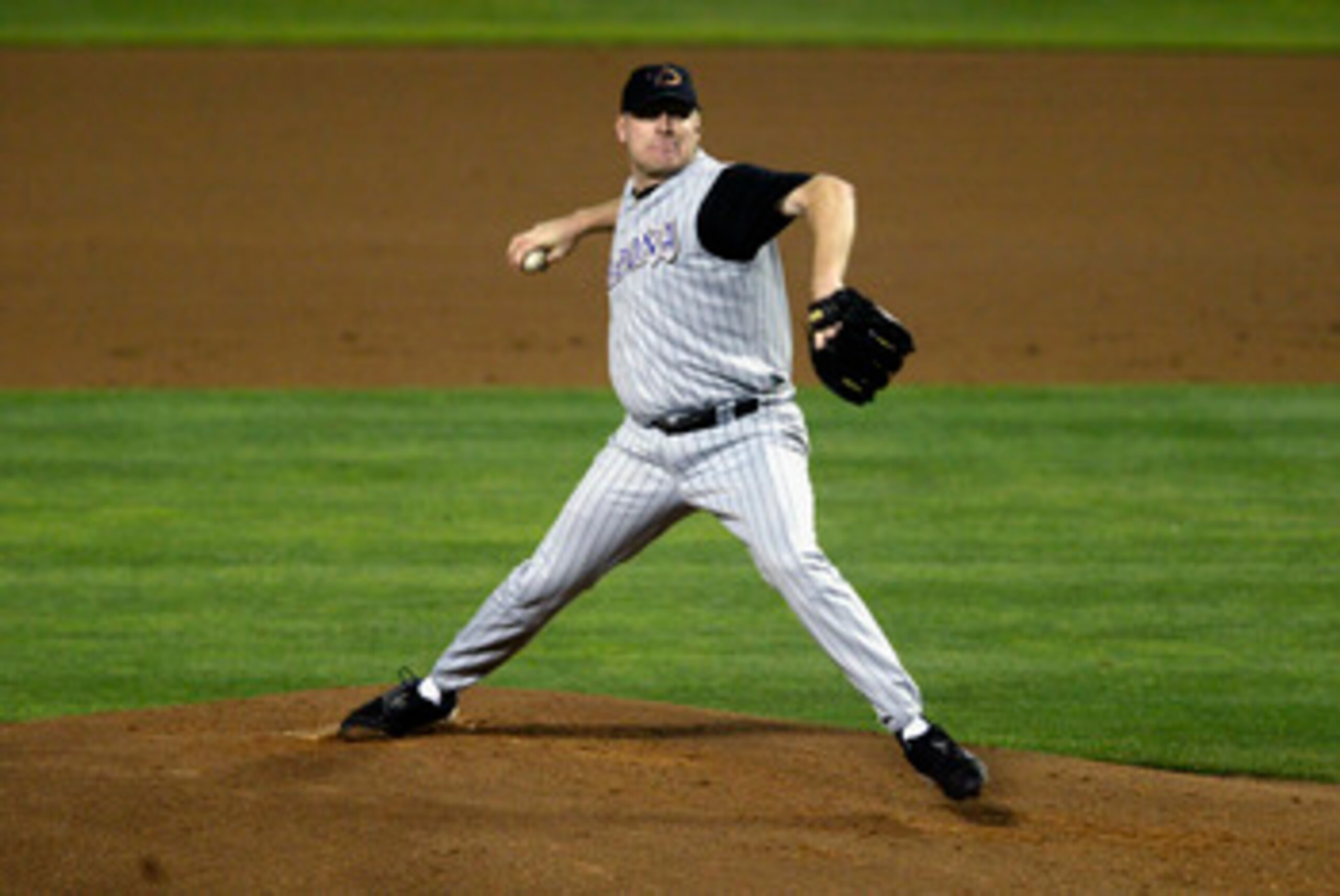 LOS ANGELES - SEPTEMBER 16:  Curt Schilling #38 of the Arizona Diamondbacks throws a pitch against the Los Angeles Dodgers during the game on September 16, 2003 at Dodger Stadium in Los Angeles, California.  The Diamondbacks defeated the Dodgers 3-2.  (Ph