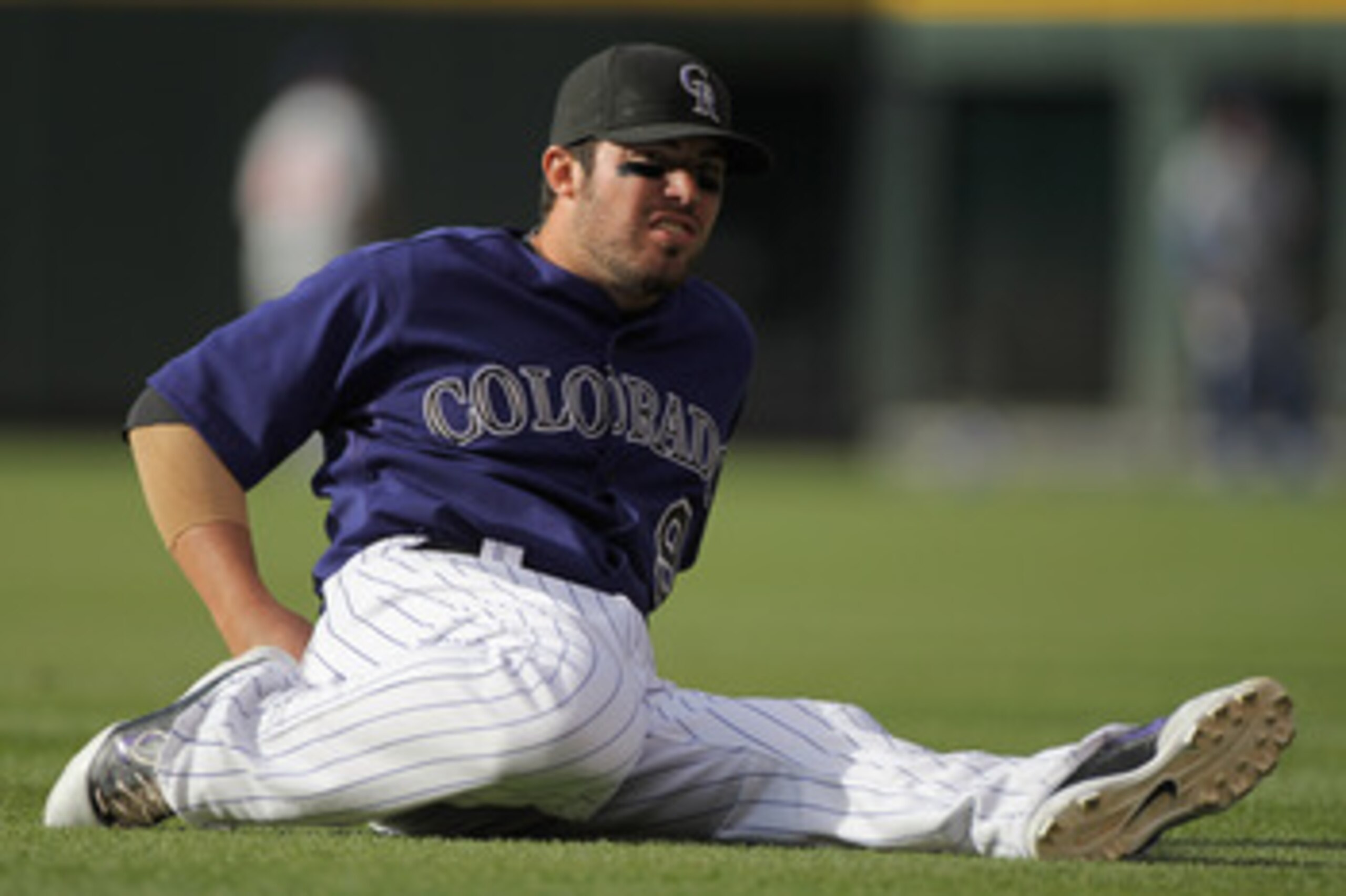 DENVER, CO - APRIL 16:  Ian Stewart #9 of the Colorado Rockies stretches prior to facing the Chicago Cubs at Coors Field on April 16, 2011 in Denver, Colorado.  (Photo by Doug Pensinger/Getty Images)