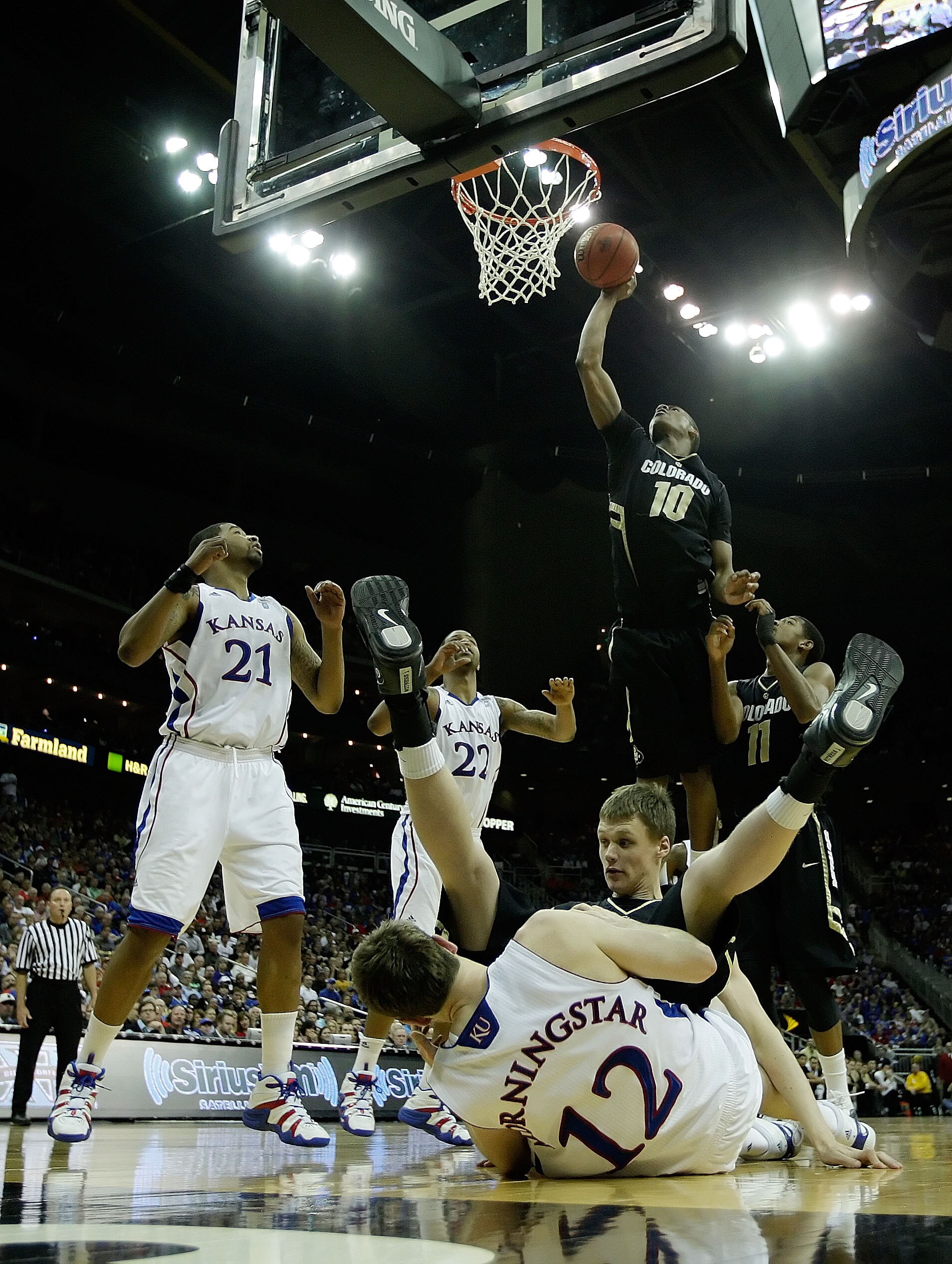 KANSAS CITY, MO - MARCH 11:  Alec Burks #10 of the Colorado Buffaloes goes up for a shot against the Kansas Jayhawks during their semifinal game in the 2011 Phillips 66 Big 12 Men's Basketball Tournament at Sprint Center on March 11, 2011 in Kansas City,