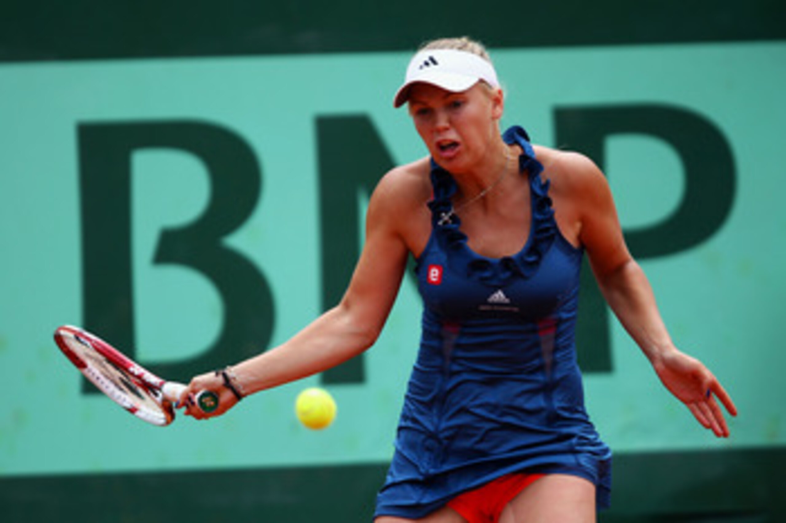 PARIS, FRANCE - MAY 27:  Caroline Wozniacki of Denmark hits a forehand during the women's singles round three match between Caroline Wozniacki of Denmark and Daniela Hantuchova of Slovakia on day six of the French Open at Roland Garros on May 27, 2011 in 
