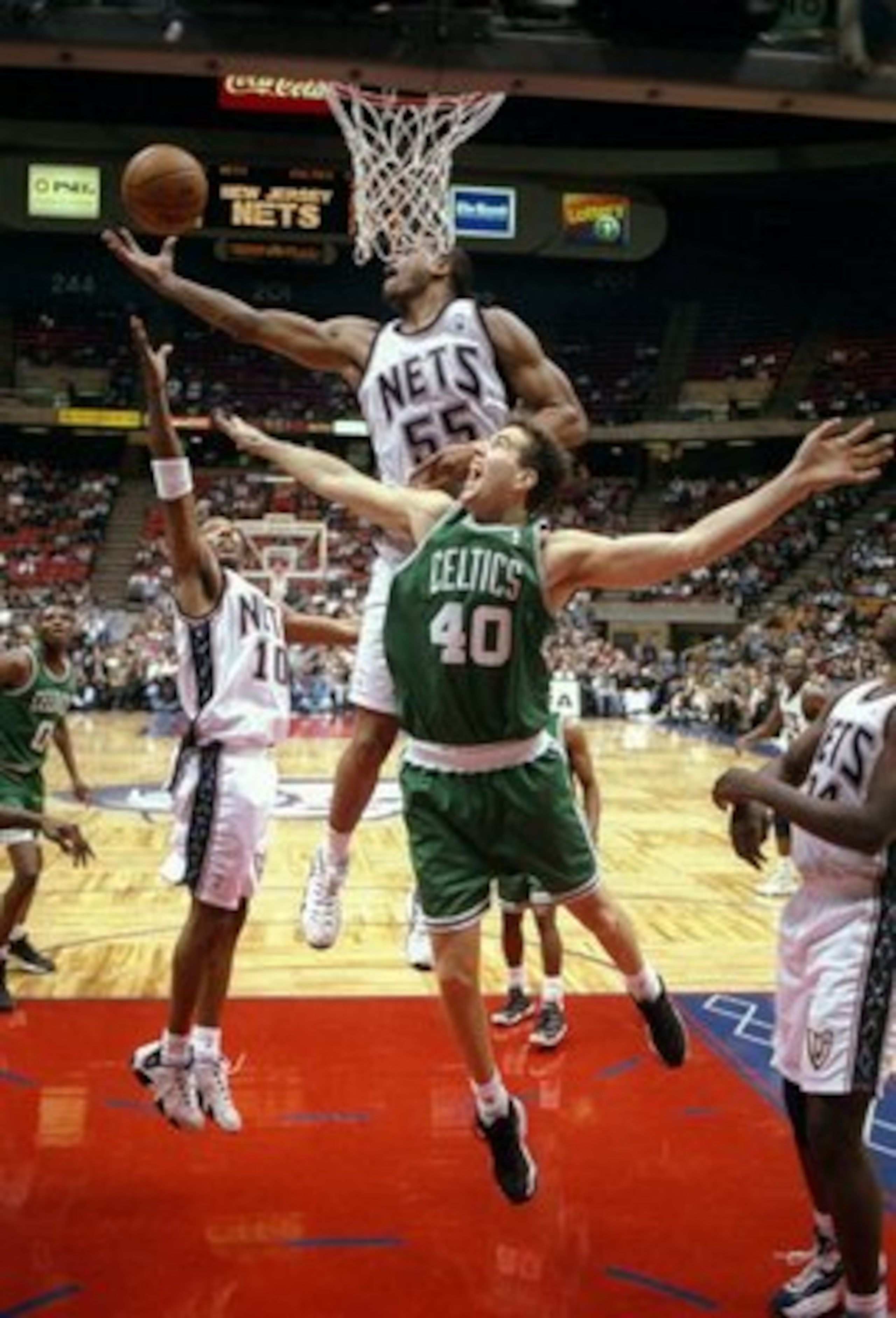 19 Nov 1997:  Center Travis Knight of the Boston Celticsbattles for the rebound with center Jayson Williams of the New Jersey Nets during a game at the Continental Airlines Arena in East Rutherford, New Jersey.  The Nets won the game 108-100. Mandatory Cr