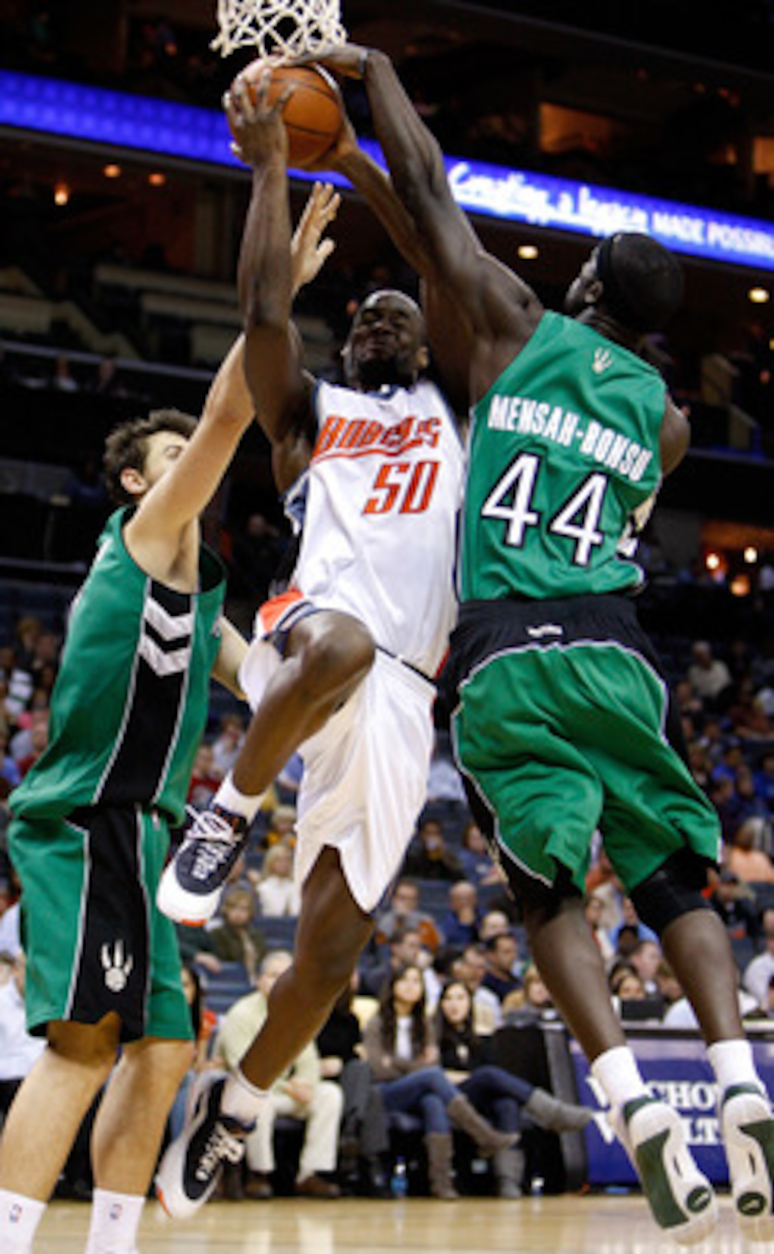 CHARLOTTE, NC - MARCH 16:  Pops Mensah-Bonsu #44 of the Toronto Raptors tries to block Emeka Okafor #50 of the Charlotte Bobcats during their game at Time Warner Cable Arena on March 16, 2009 in Charlotte, North Carolina.  NOTE TO USER: User expressly ack