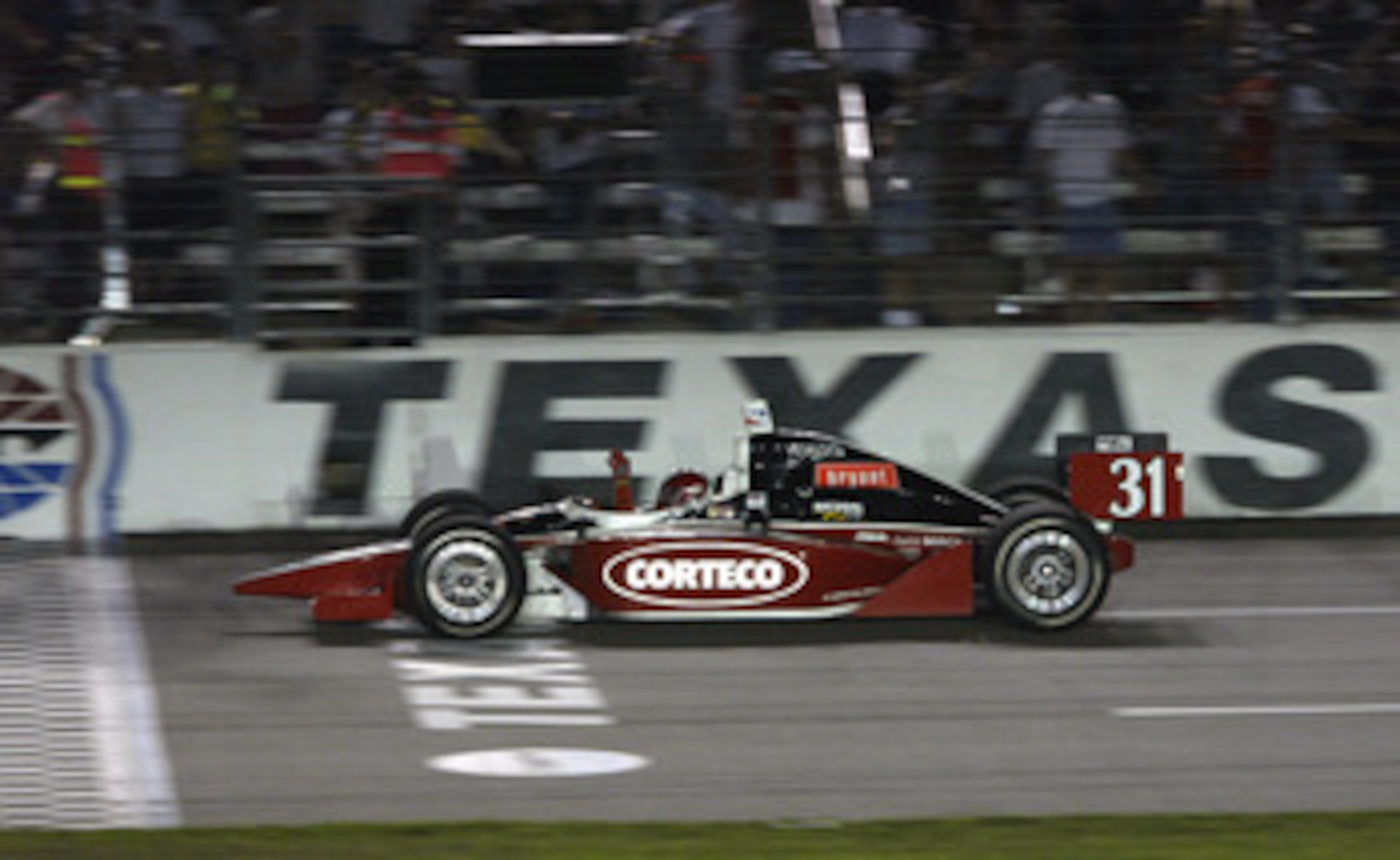 FT. WORTH, TX - JUNE 7: Al Unser Jr. celebrates as he crosses the finish line to win the IRL (Indy Racing League) IndyCar Series Bombardier 500 on June 7, 2003 at the Texas Motor Speedway in Ft. Worth, Texas. (Photo by Jonathan Ferrey/Getty Images). FT. WORTH, TX - JUNE 7: Al Unser Jr. celebrates as he crosses the finish line to win the IRL (Indy Racing League) IndyCar Series Bombardier 500 on June 7, 2003 at the Texas Motor Speedway in Ft. Worth, Texas. (Photo by Jonathan Ferrey/Getty Images).