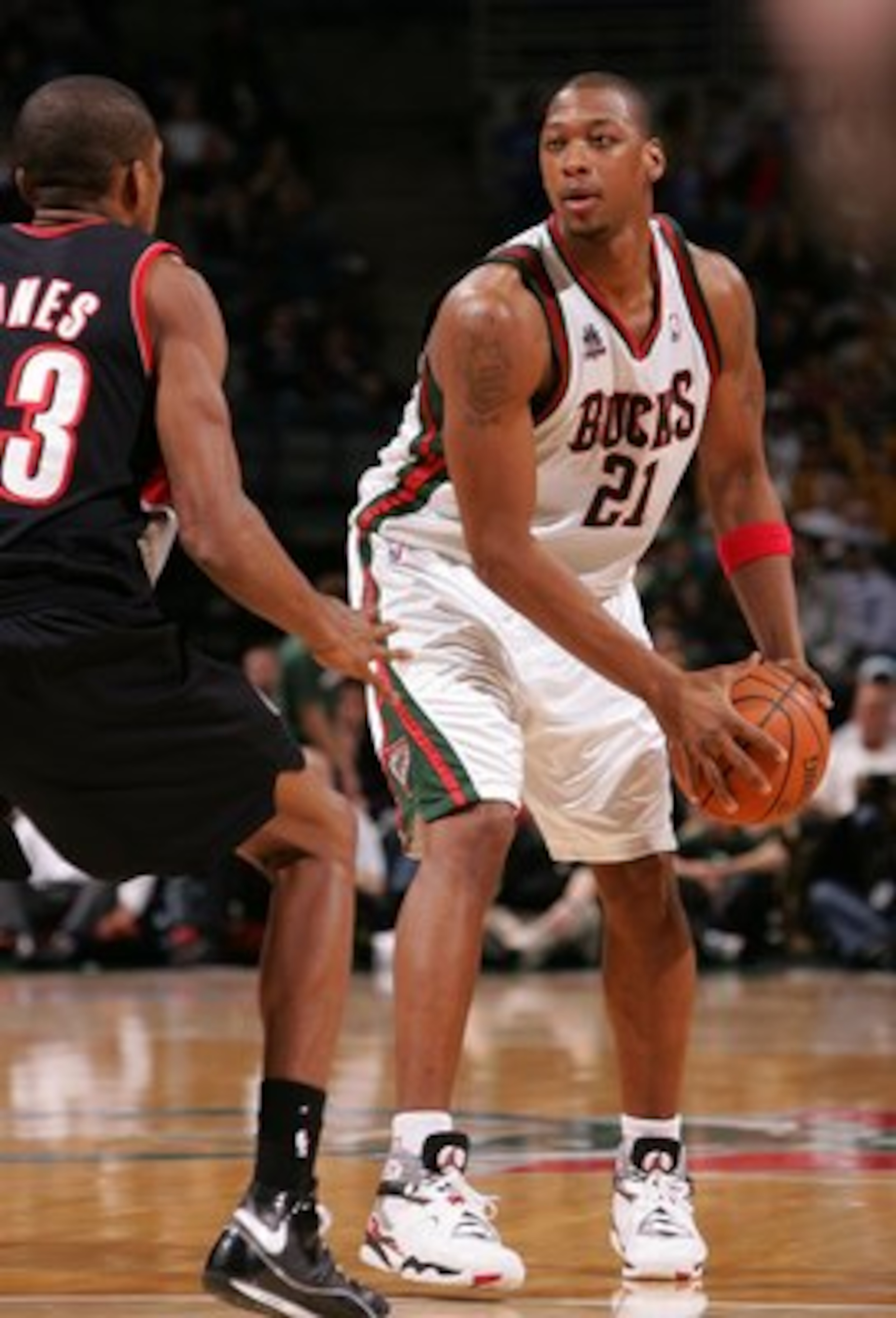 MILWAUKEE - MARCH 07: Bobby Simmons #21 of the Milwaukee Bucks looks to passd against James Jones #33 of the Portland Trail Blazers on March 7, 2008 at the Bradley Center in Milwaukee, Wisconsin. The Trail Blazers defeated the Bucks 103-101. NOTE TO USER: