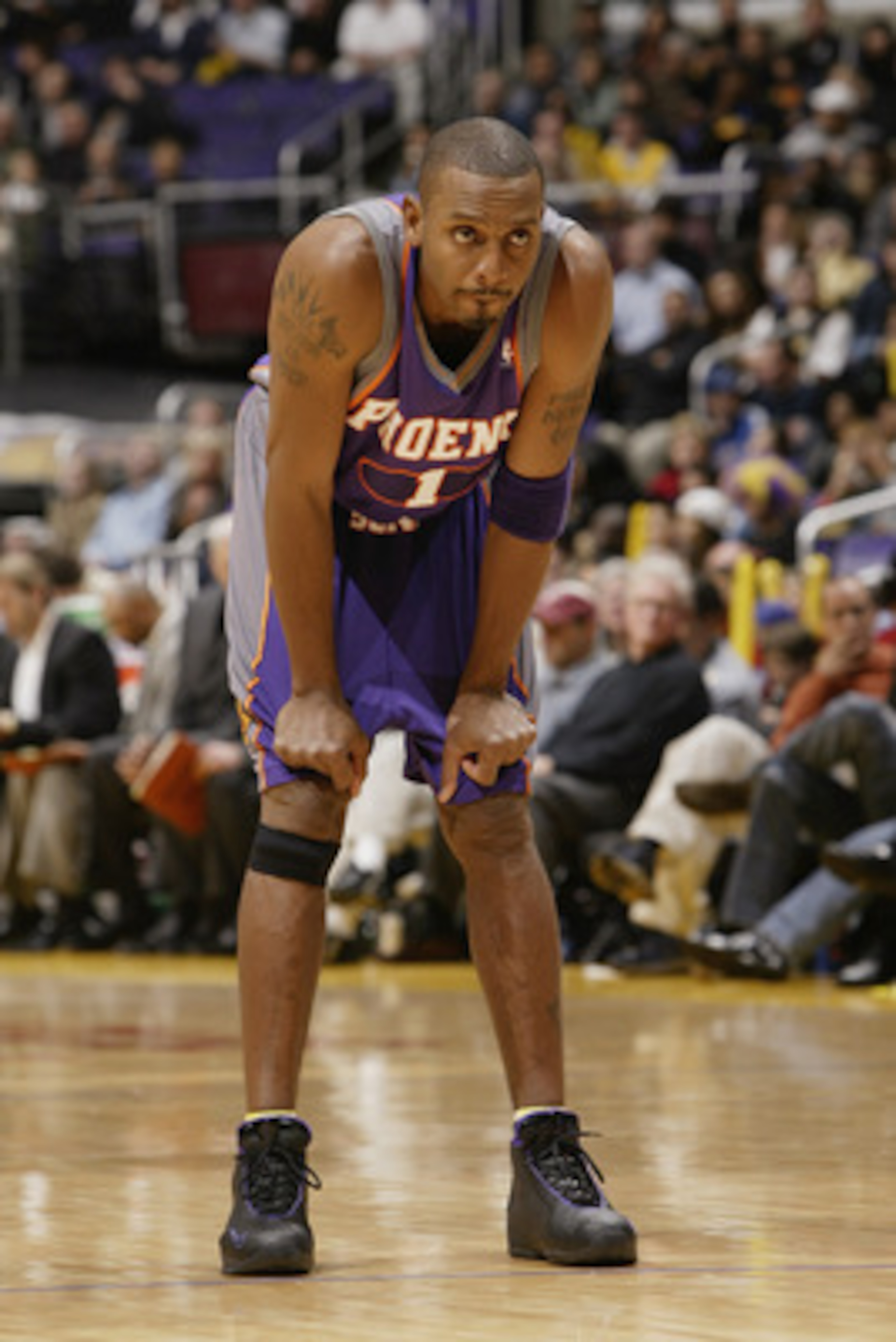 LOS ANGELES - DECEMBER 21:  Anfernee Hardaway #1 of the Phoenix Suns rests during the game against the Los Angeles Lakers at Staples Center on December 21, 2003 in Los Angeles, California.  The Lakers won 107-101.  (Photo by Stephen Dunn/Getty Images)