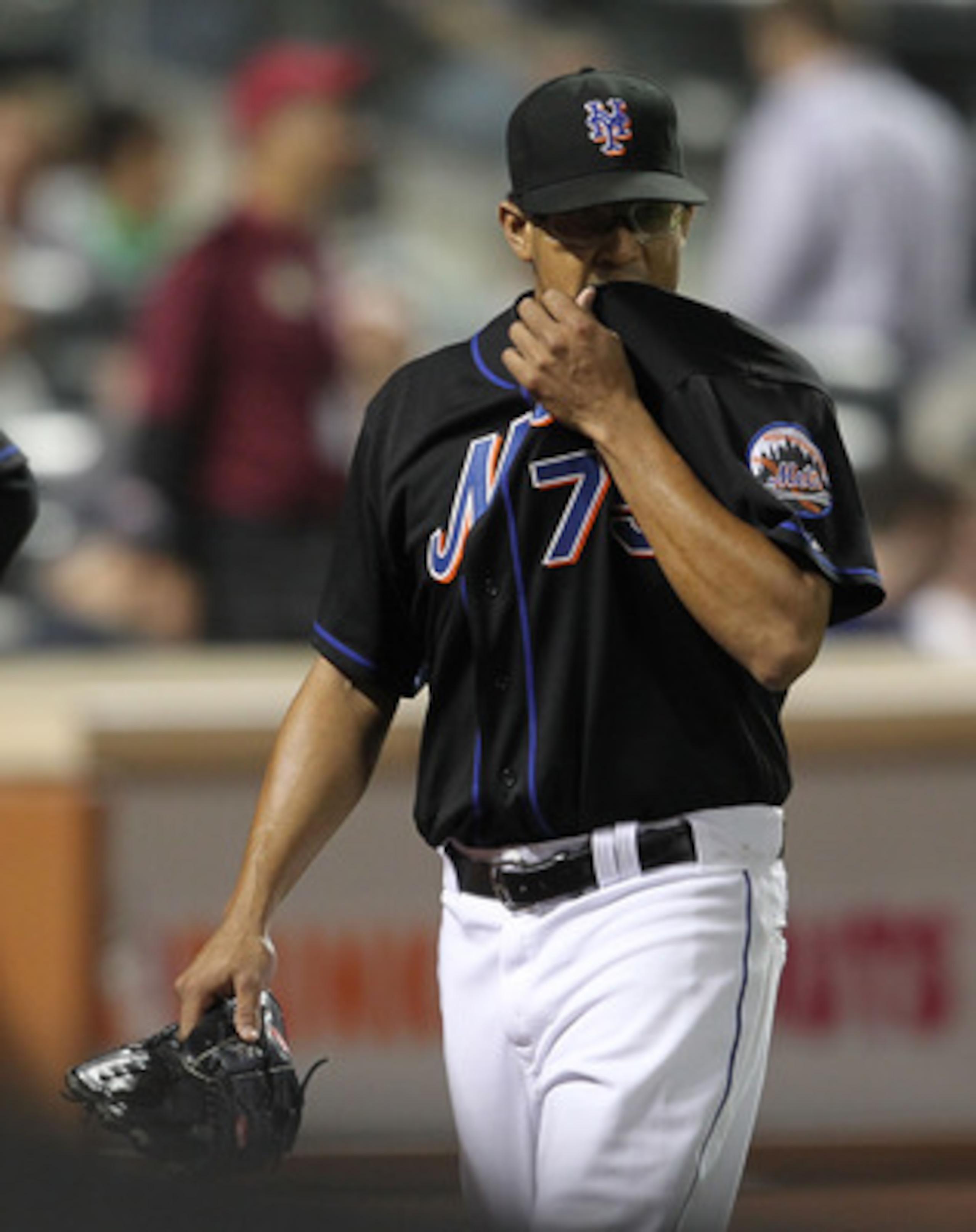 NEW YORK, NY - JUNE 03: Francisco Rodriguez #75 of the New York Mets walks to the dugout after giving up three runs in the ninth inning against the Atlanta Braves at Citi Field on June 3, 2011 in the Flushing neighborhood of the Queens borough of New York