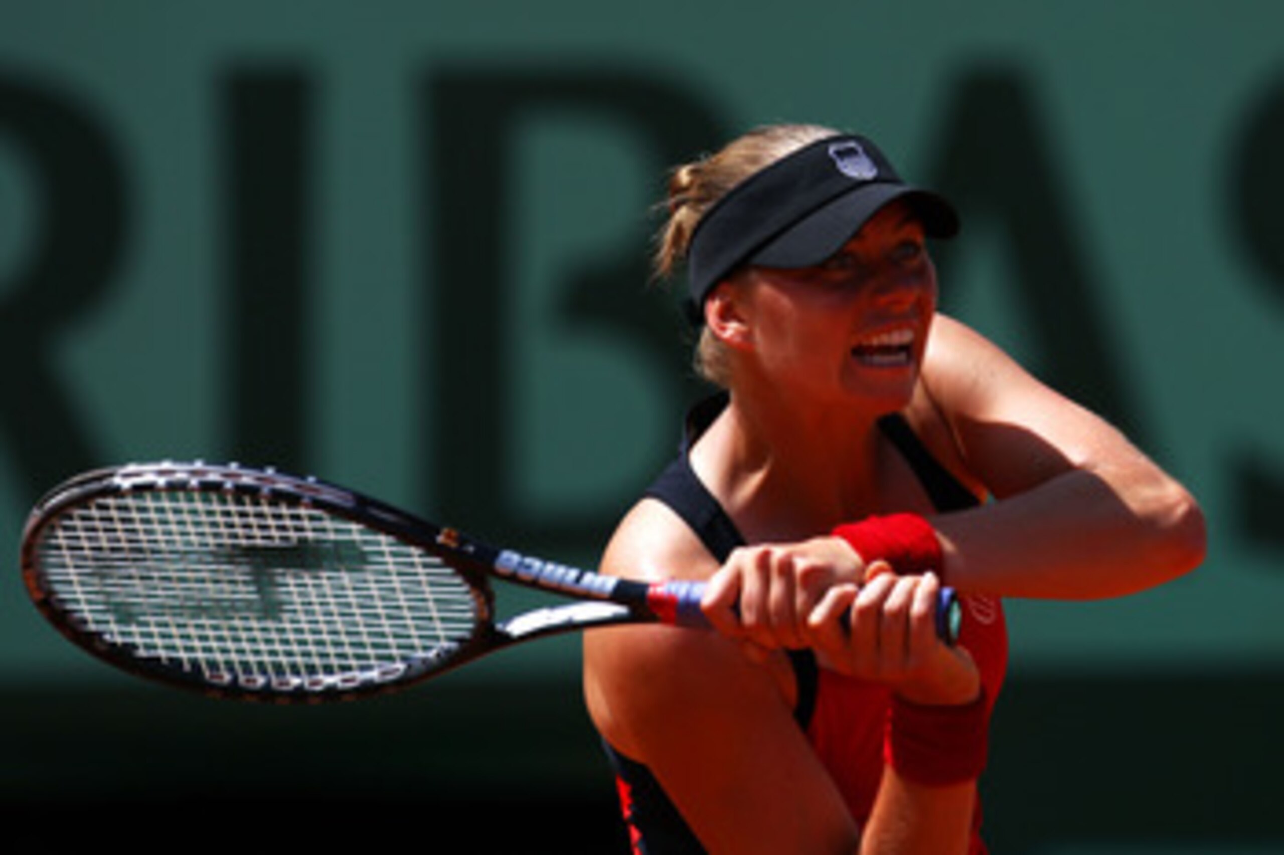 PARIS, FRANCE - MAY 29:  Vera Zvonareva of Russia hits a backhand during the women's singles round four match between Vera Zvonareva of Russia and Anastasia Pavlyuchenkova of Russia on day eight of the French Open at Roland Garros on May 29, 2011 in Paris
