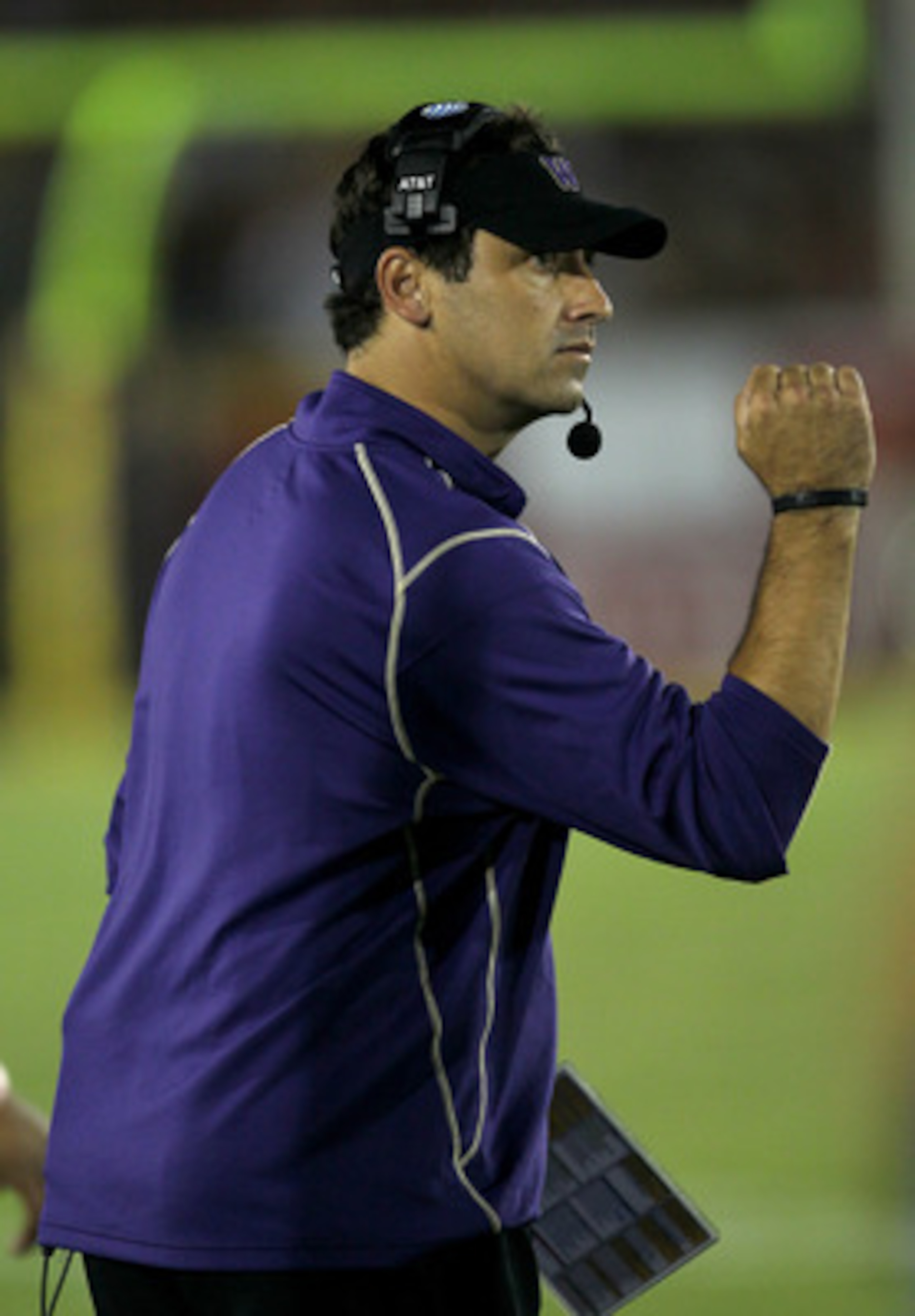 LOS ANGELES, CA - OCTOBER 02:  Head coach Steve Sarkisian of the Washington Huskies pumps his fist after a Huskies field goal in the third quarter against the USC Trojans at the  Angeles Memorial Coliseum on October 2, 2010 in Los Angeles, California.  Wa