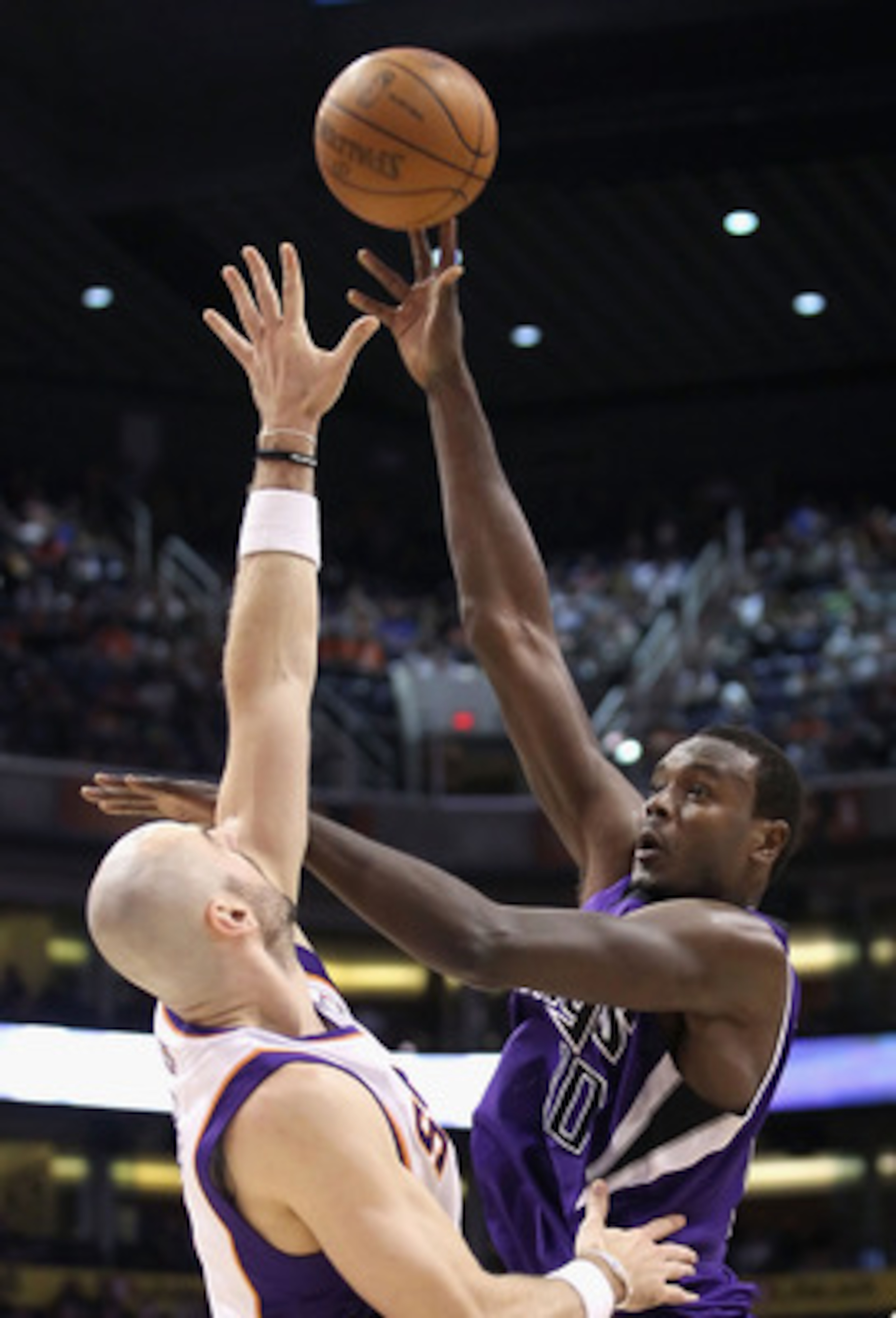 PHOENIX, AZ - FEBRUARY 13:  Samuel Dalembert #10 of the Sacramento Kings puts up a shot over Marcin Gortat #4 of the Phoenix Suns during the NBA game at US Airways Center on February 13, 2011 in Phoenix, Arizona. The Kings defeated the Suns 113-108.  NOTE