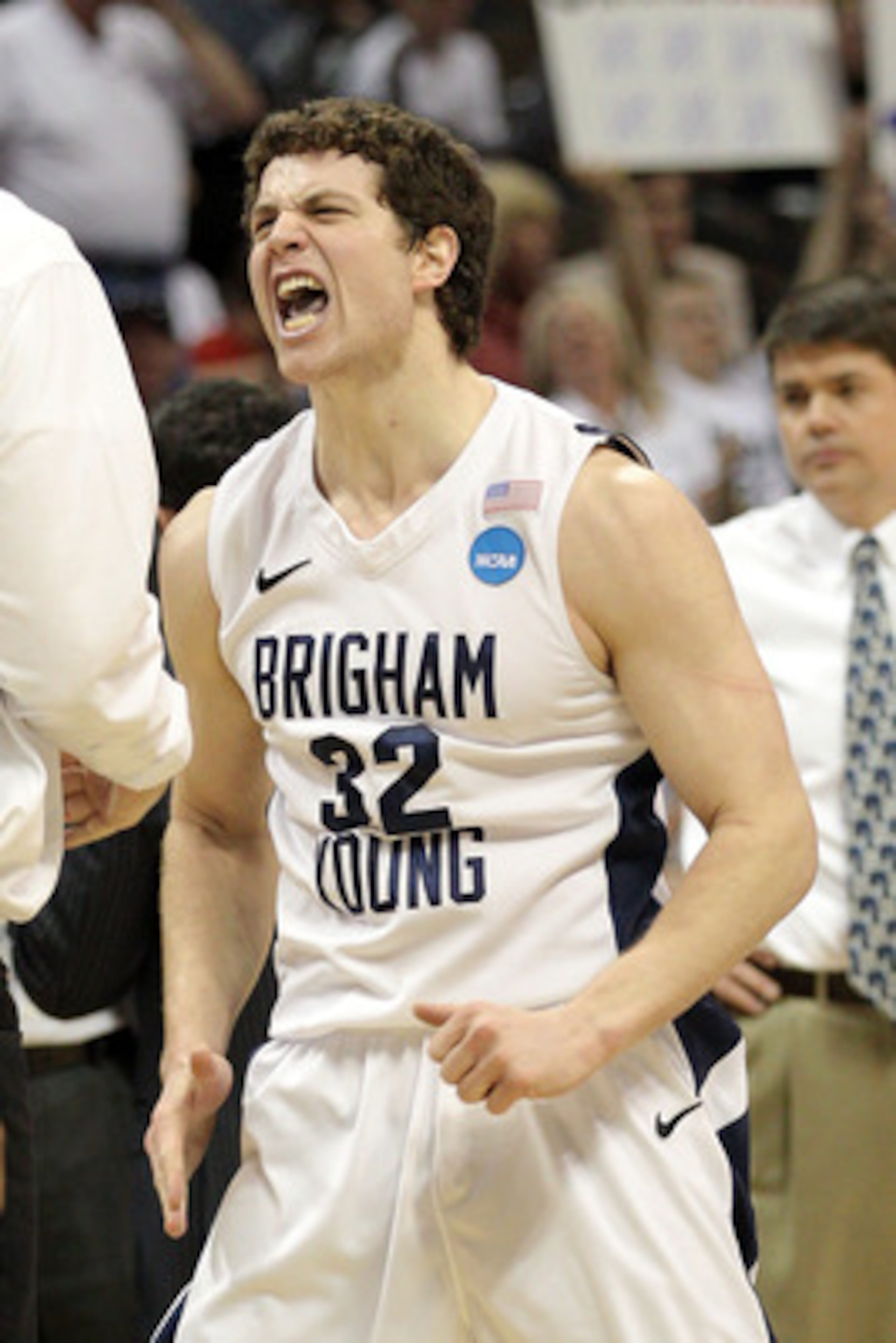 DENVER, CO - MARCH 19:  Jimmer Fredette #32 of the Brigham Young Cougars celebrates after a play against the Gonzaga Bulldogs during the third round of the 2011 NCAA men's basketball tournament at Pepsi Center on March 19, 2011 in Denver, Colorado.  (Phot