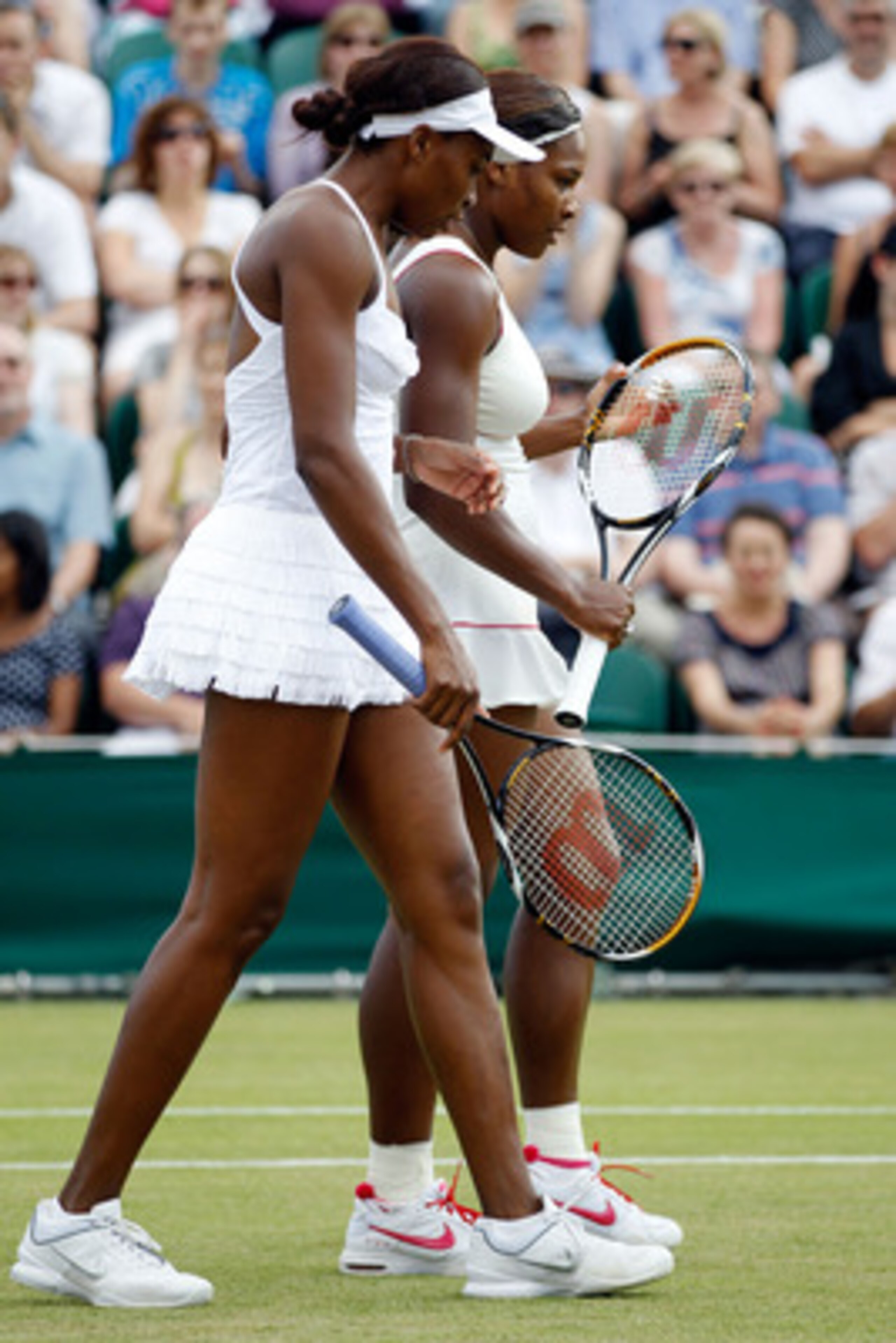 LONDON, ENGLAND - JUNE 26:  Serena Williams of USA and Venus Williams of USA in action during their doubles match against Dominika Cibulkova of Slovakia and Anastasia Pavlyuchenkova of Russia  on Day Six of the Wimbledon Lawn Tennis Championships at the A