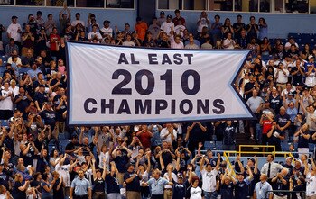 ST. PETERSBURG, FL - APRIL 01:  The Tampa Bay Rays raise their 2010 American League East championship banner just before the start of the Opening Day game against the Baltimore Orioles at Tropicana Field on April 1, 2011 in St. Petersburg, Florida.  (Phot