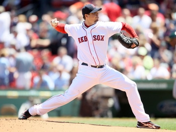 BOSTON, MA - JUNE 04:  Josh Beckett #19 of the Boston Red Sox delivers a pitch in the first inning against the Oakland Athletics on June 4, 2011 at Fenway Park in Boston, Massachusetts.  (Photo by Elsa/Getty Images)