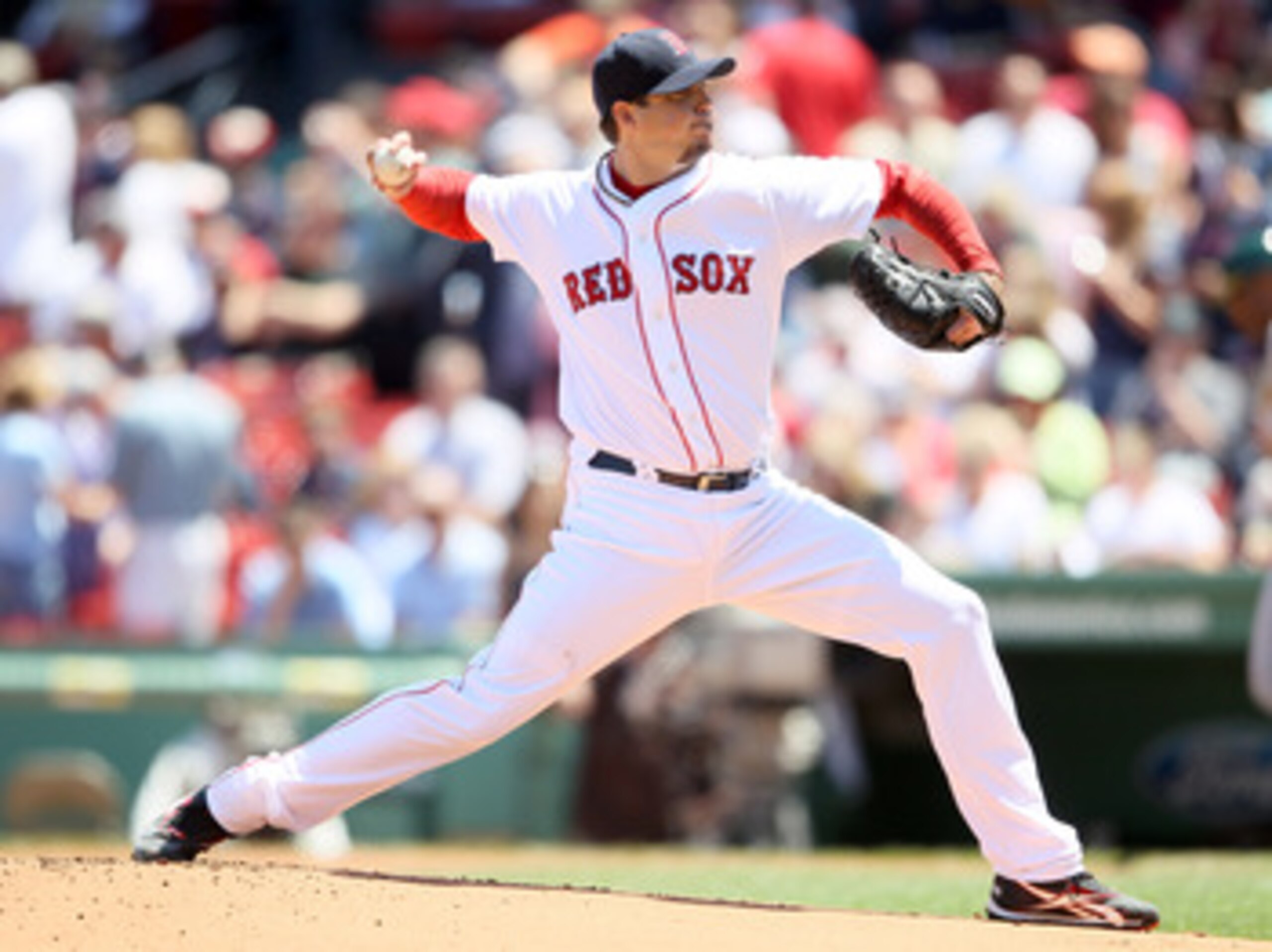 BOSTON, MA - JUNE 04:  Josh Beckett #19 of the Boston Red Sox delivers a pitch in the first inning against the Oakland Athletics on June 4, 2011 at Fenway Park in Boston, Massachusetts.  (Photo by Elsa/Getty Images)