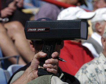 A baseball scout behind homeplate is armed with a pen and a radar gun  March 8, 2004 during  a spring training game against the Pittsburgh Pirates in Dunedin, Florida. (Photo by A. Messerschmidt/Getty Images) *** Local Caption ***