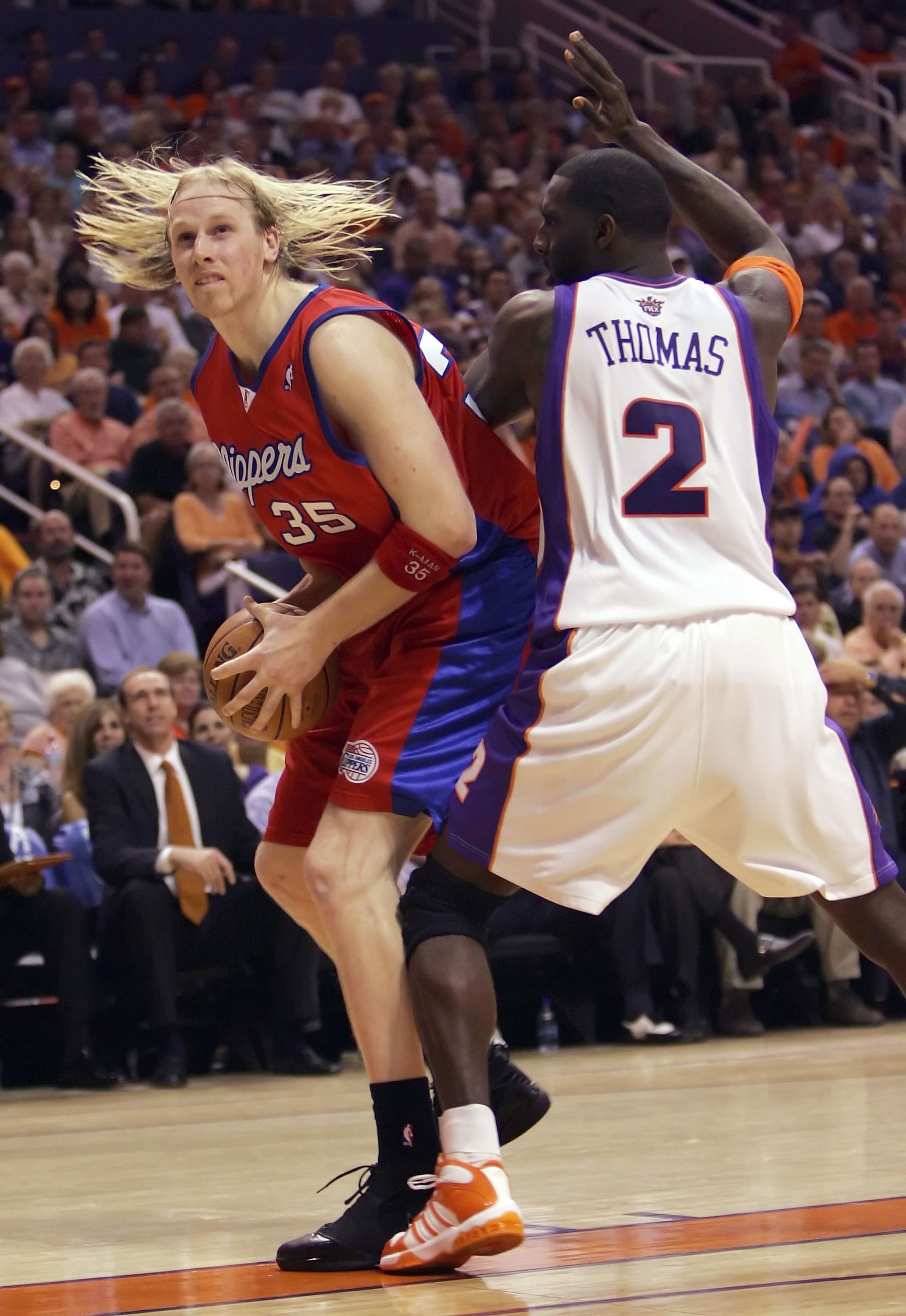 PHOENIX - MAY 8:     Chris Kaman #35 of the Los Angeles Clippers drives against Tim Thomas #2 of the Phoenix Suns in game one of the Western Conference Semifinals during the 2006 NBA Playoffs on May 8, 2006 at US Airways Arena in Phoenix, Arizona.  NOTE T